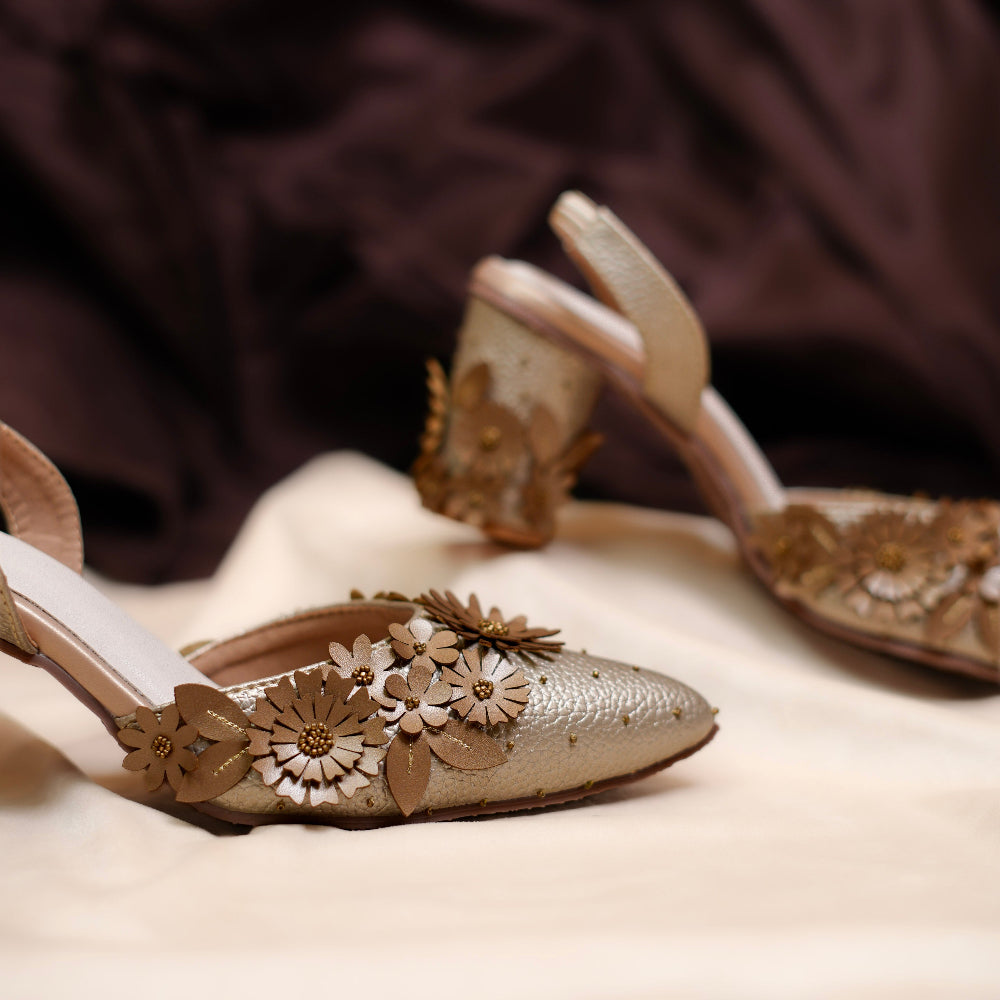 Embellished pointed-toe mules with layered 3D flowers
