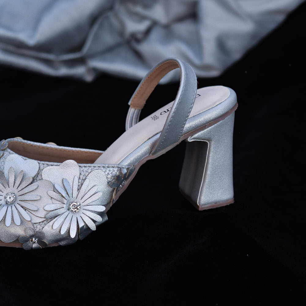 Silver occasion heels featuring raised floral embellishments
