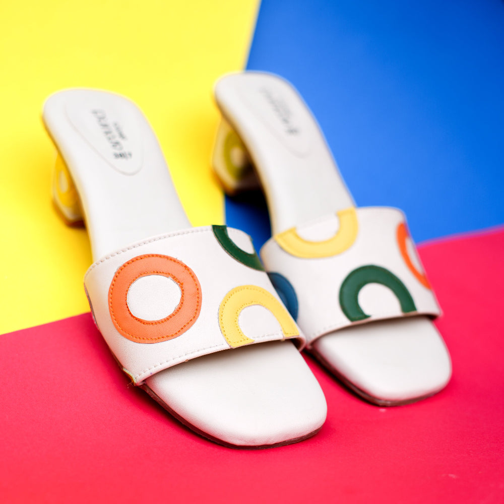White with colourful circular appliqué details and block heel
