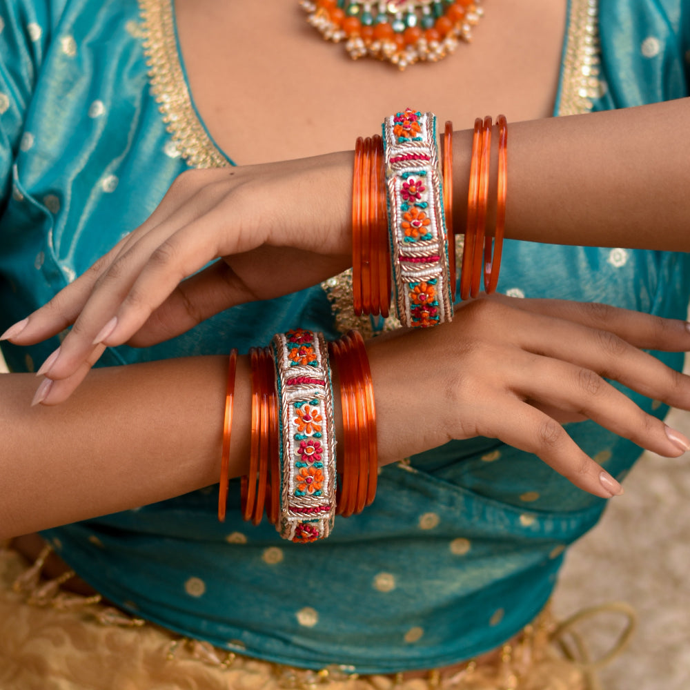 Bright ethnic bangles from a haldo jewellery set with colourful thread accents