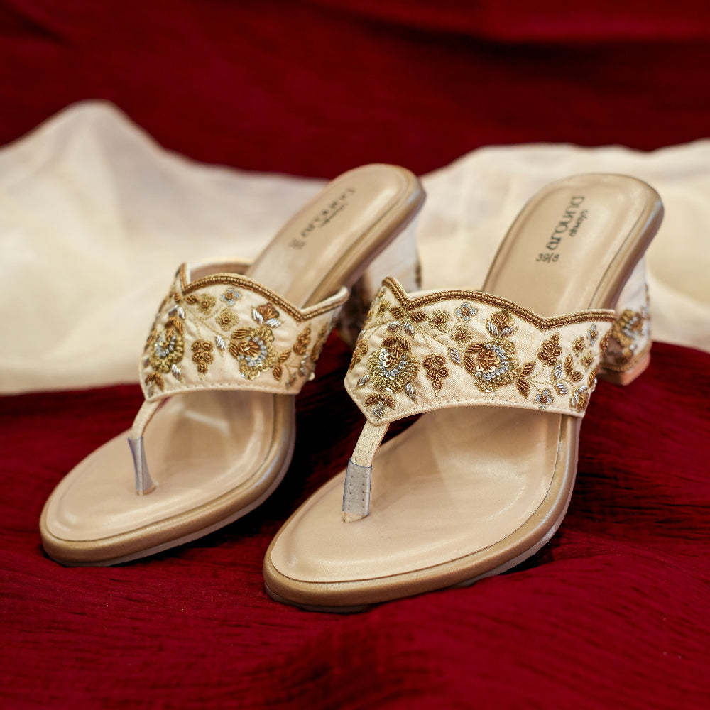 Festive ivory mule with antique gold floral embroidery
