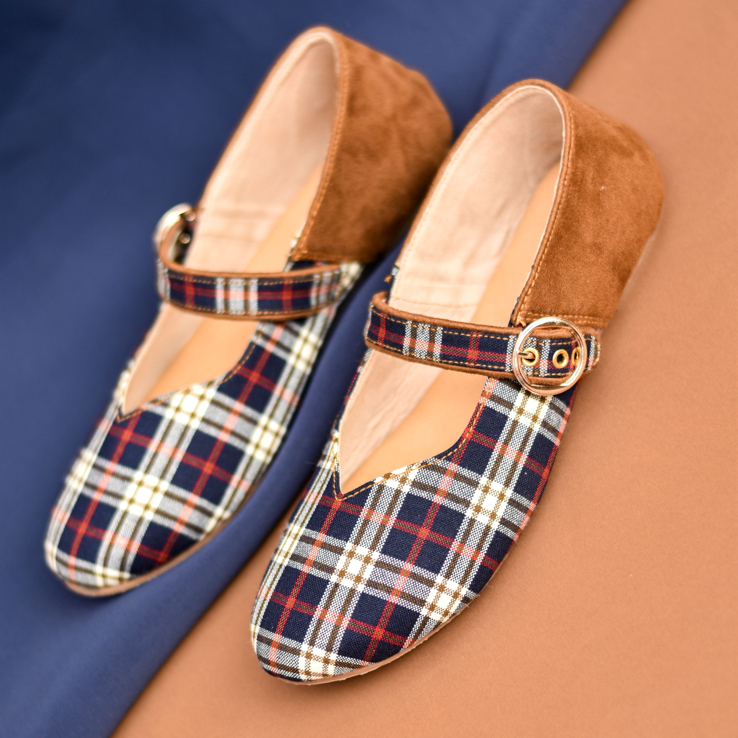 Retro-style navy rust check shoes with gold buckle and comfortable sole.