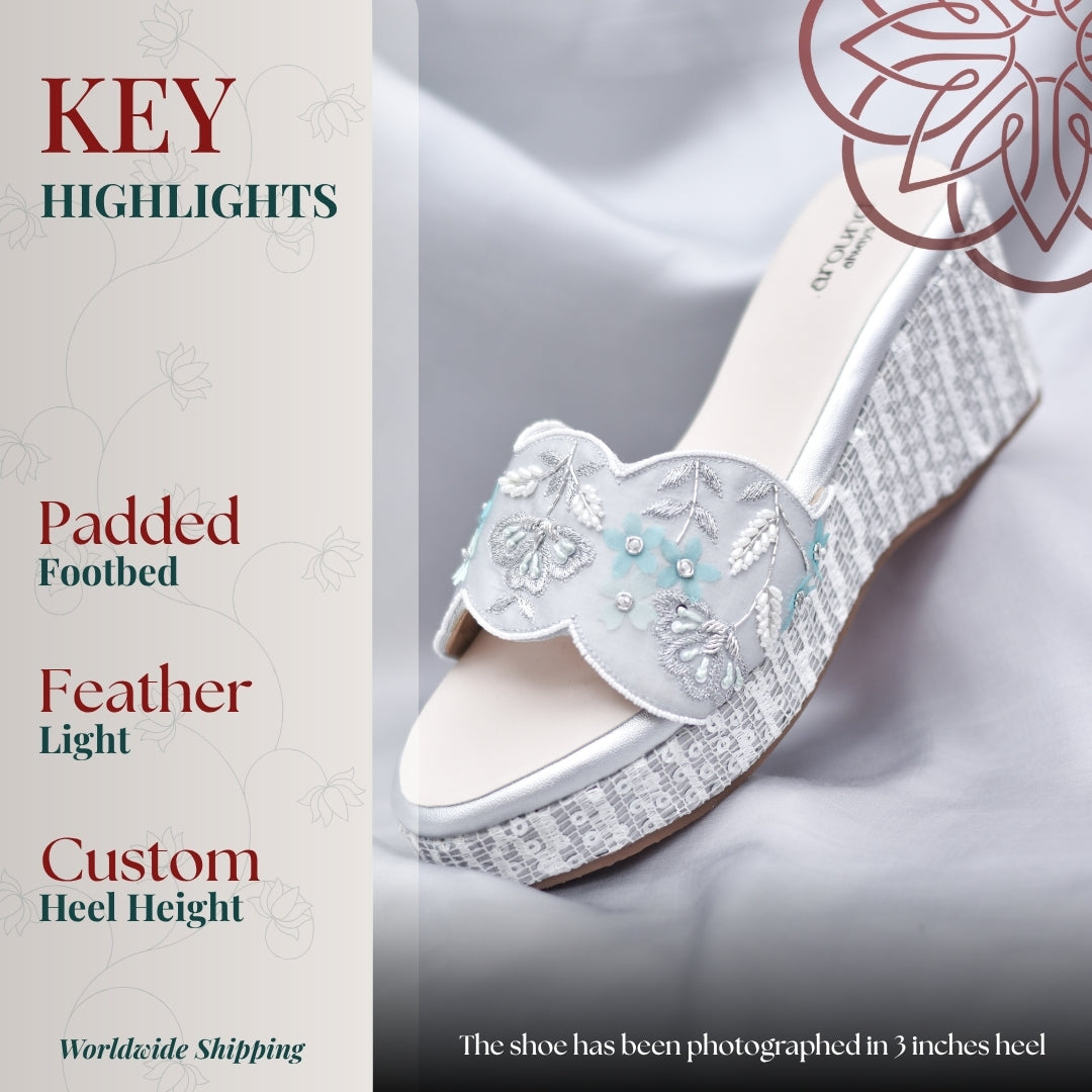 White floral embroidered wedge sandal with scalloped edge strap