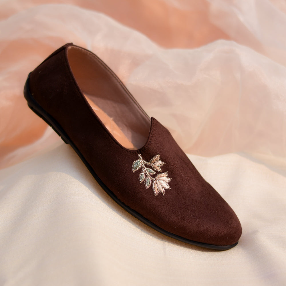 Dark brown ethnic mojri with minimal embroidery, smooth suede texture, and supportive cushioned footbed