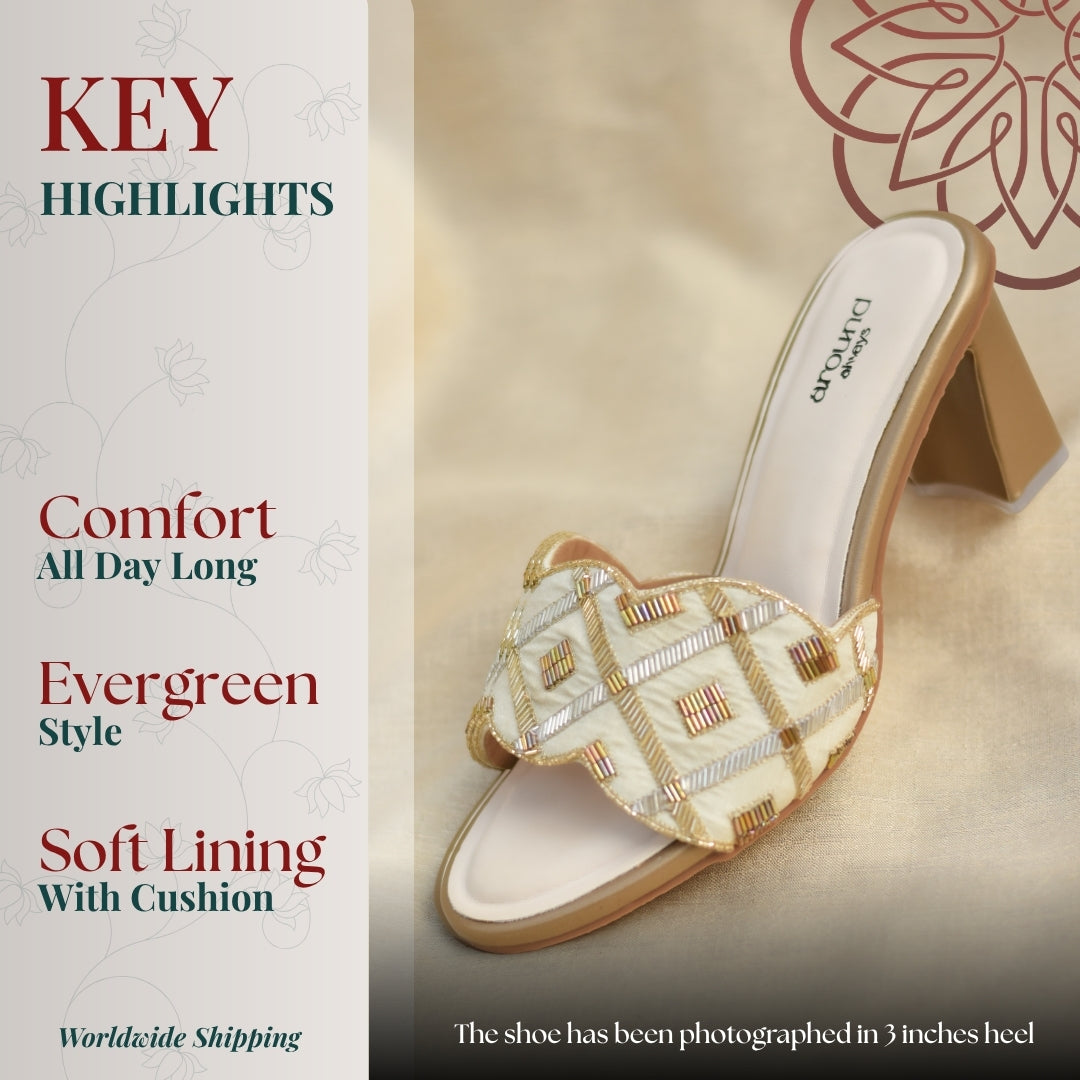 Beige embroidered block heel mule with geometric beadwork' cushioned insole, and mid height heel 