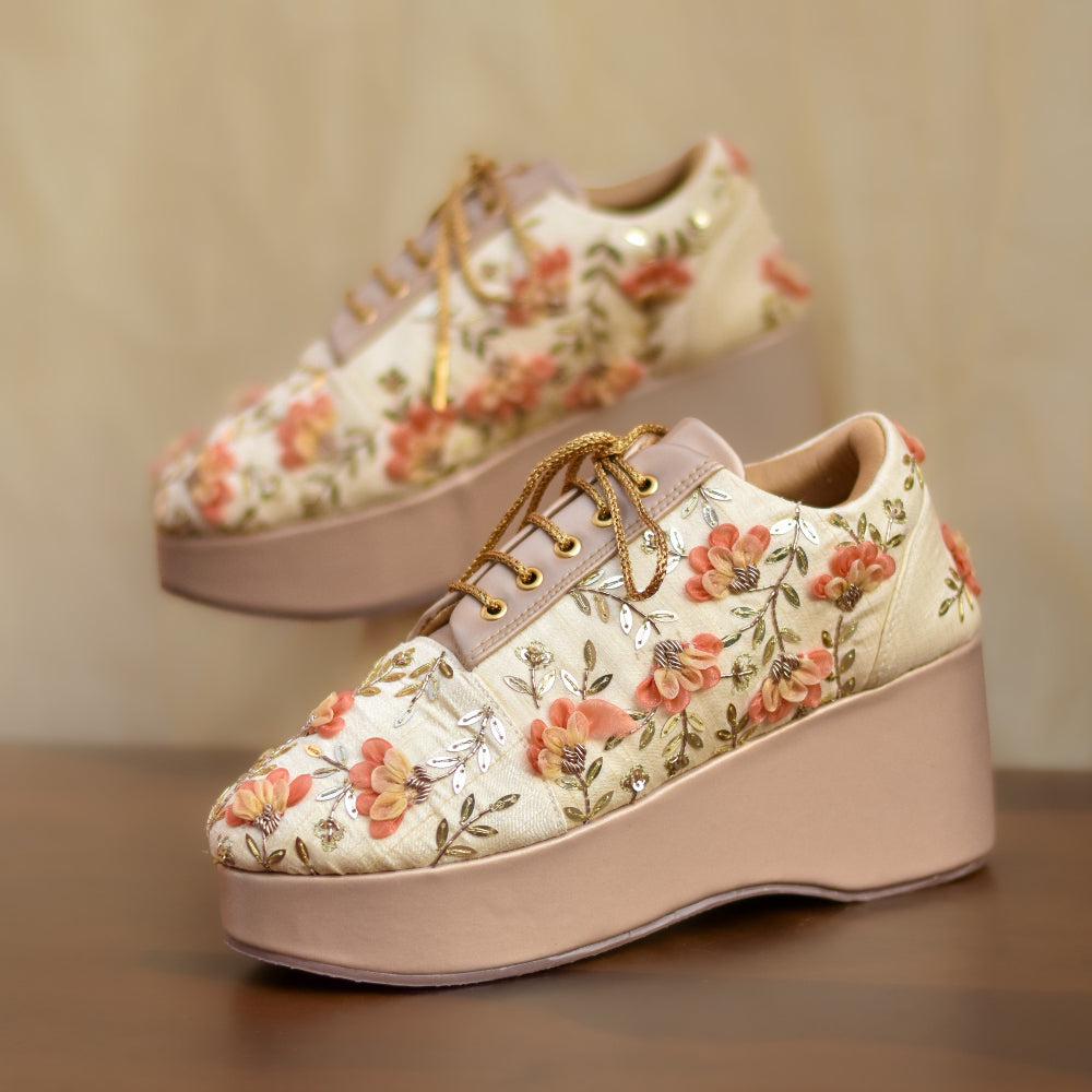 Beige festive sneakers with 3D floral motifs and a platform sole