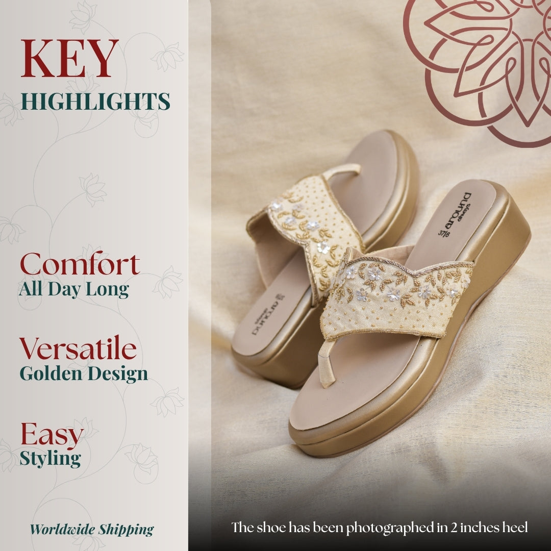 Elegant gold wedge with floral detailing, cushioned sole, and comfortable for festive wear