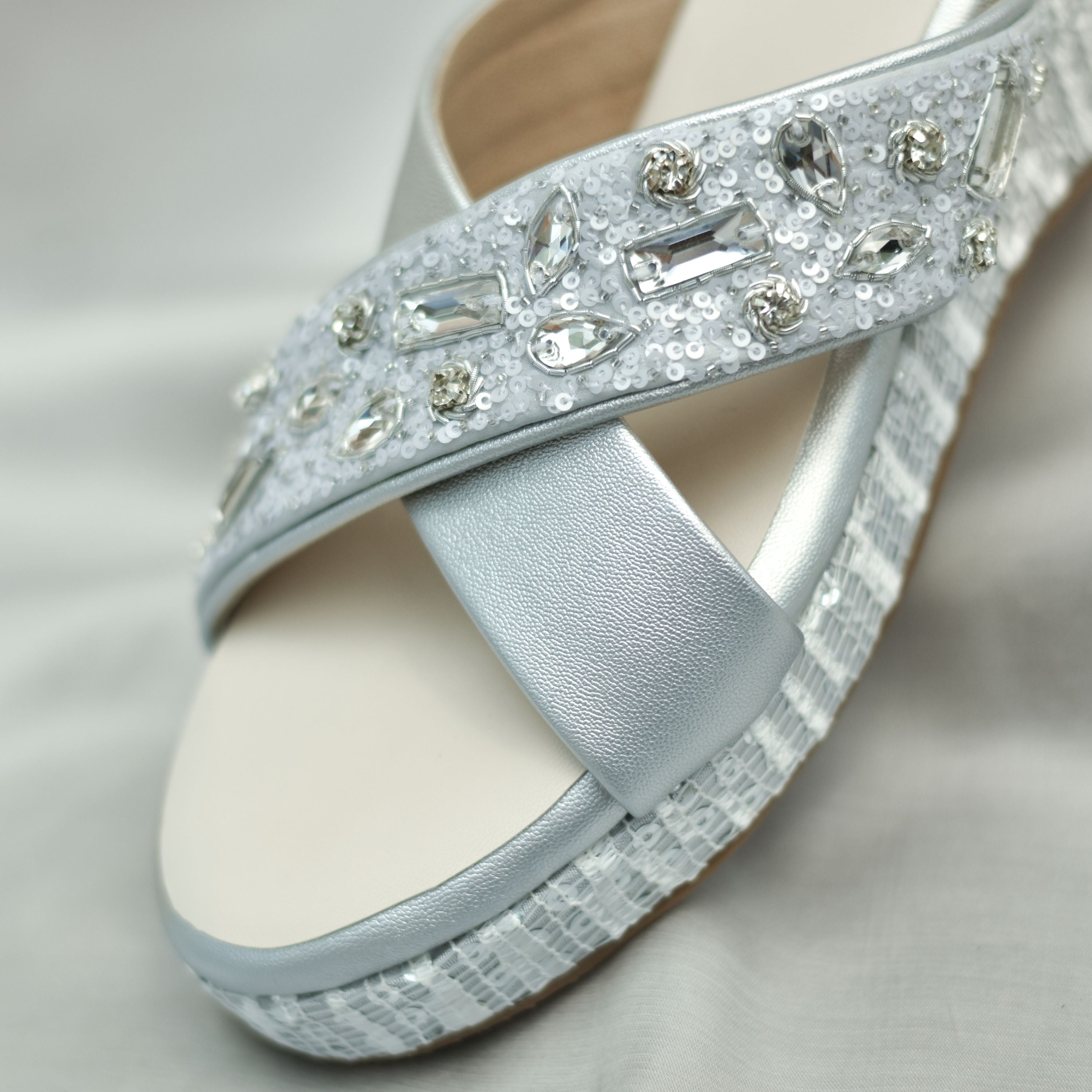 Occasion footwear with sequin detailing and textured heel.