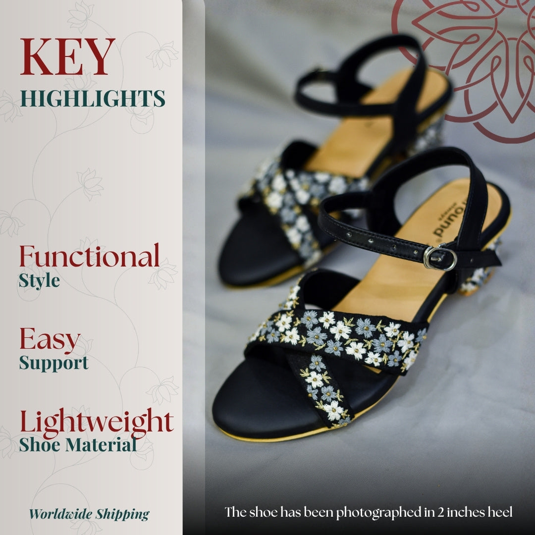 Black block heel sandals with daisy pattern details