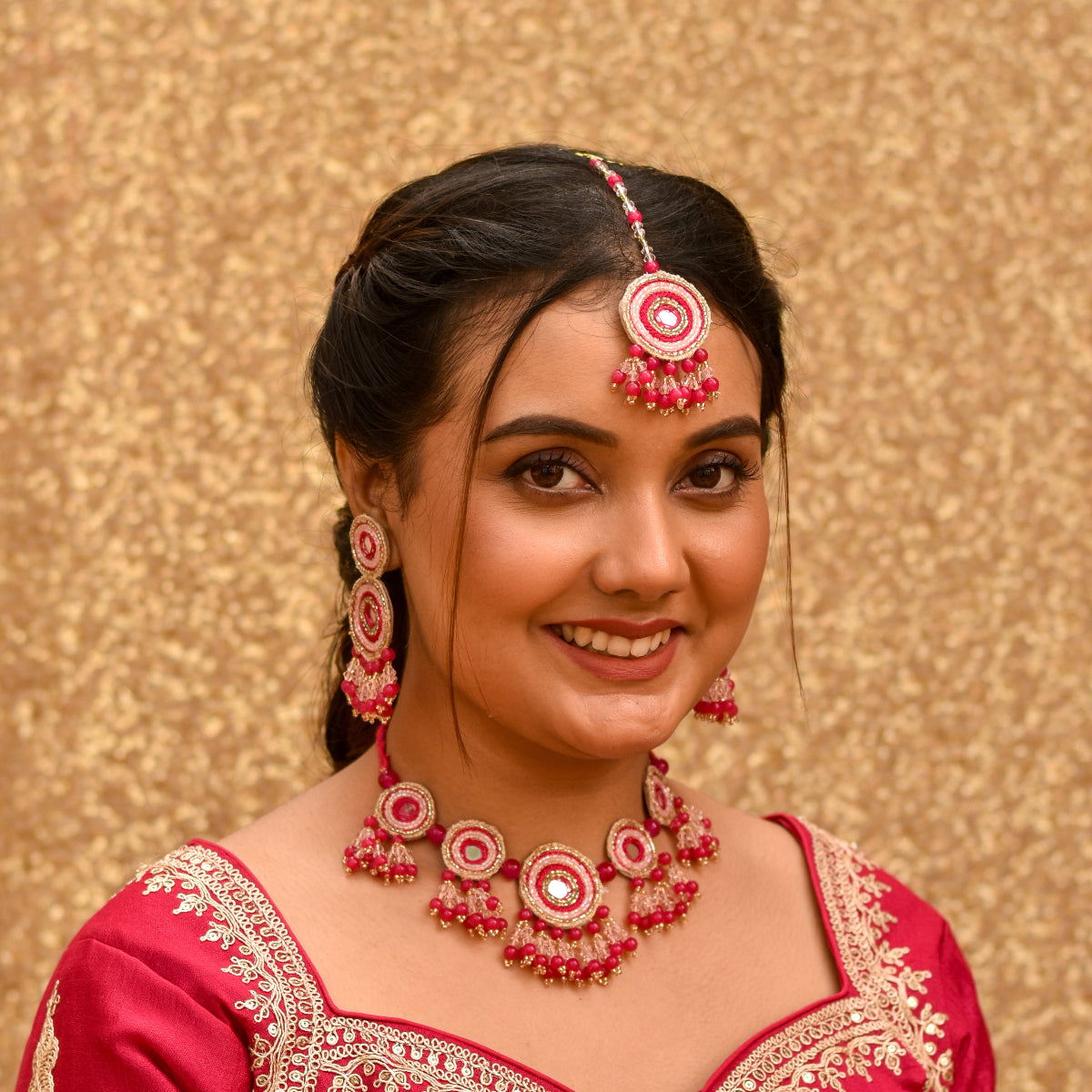 A bengali bride wearing a traditional beaded jewellery for her holud ceremony