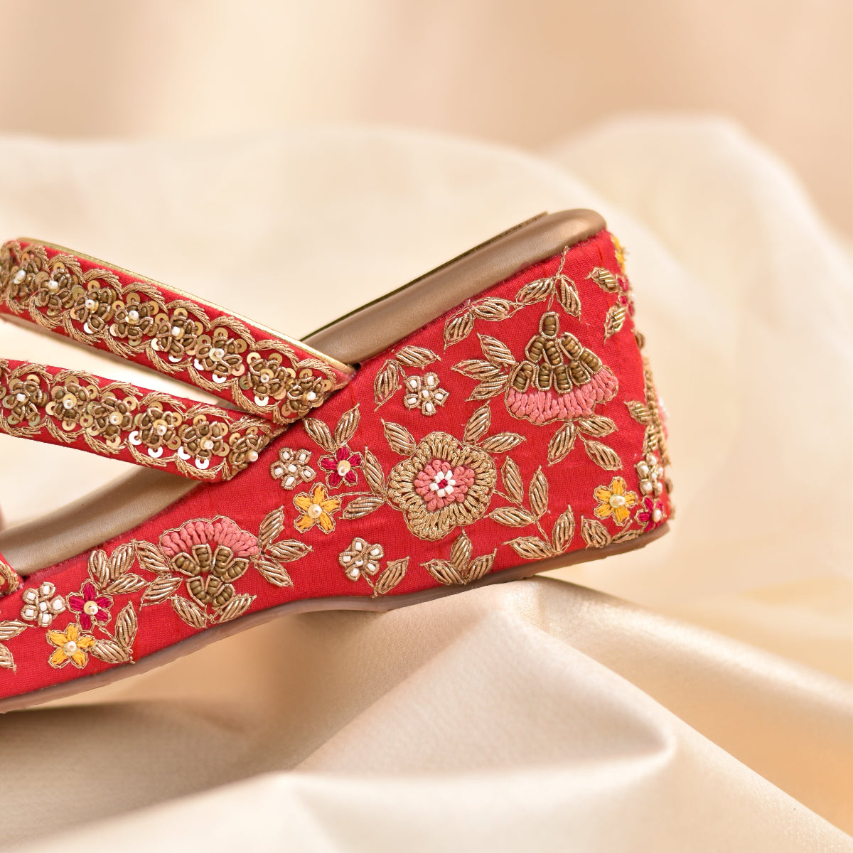 Red embroidered shoe with gold detailing for Indian weddings