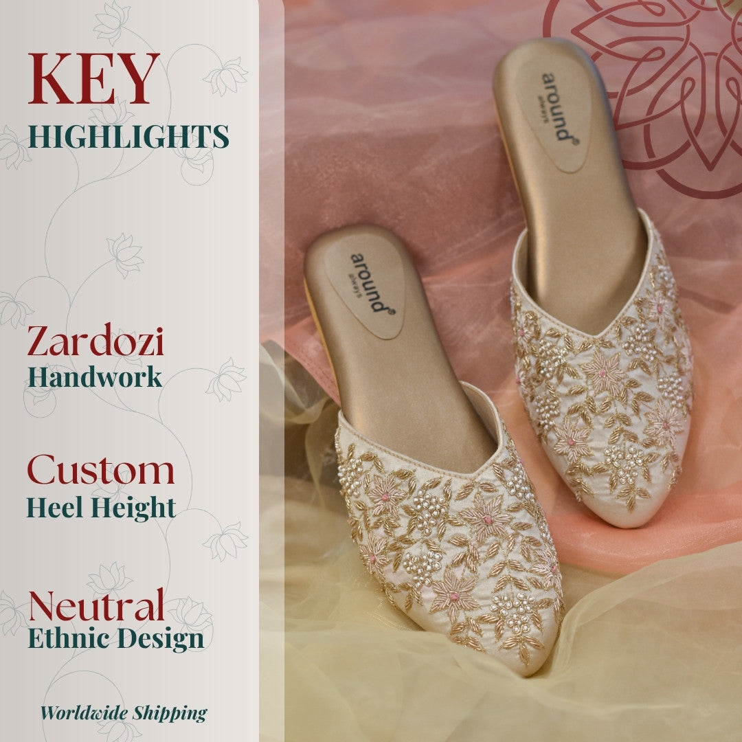 Ivory pastel bridal mules with low heels and tone on tone zardozi embroidery