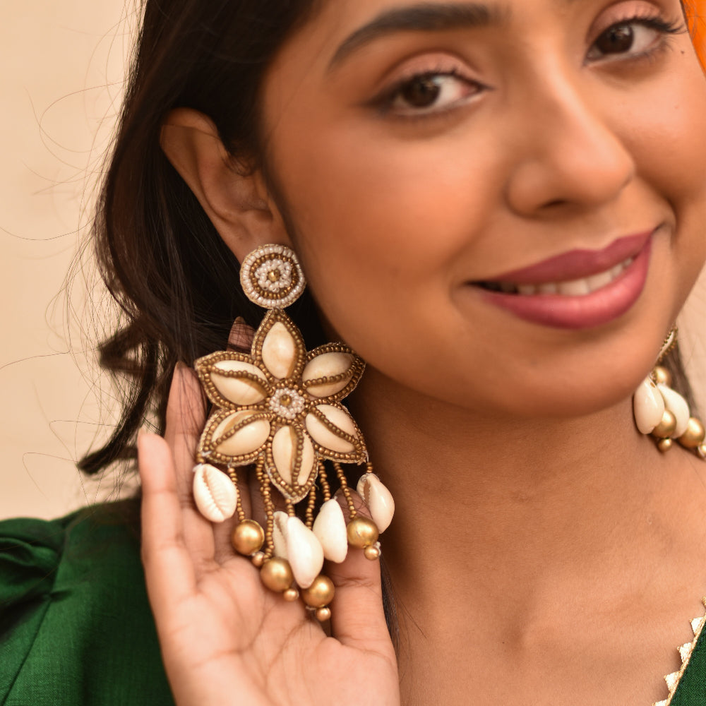 Handcrafted ethnic earrings with shell and gold detailing