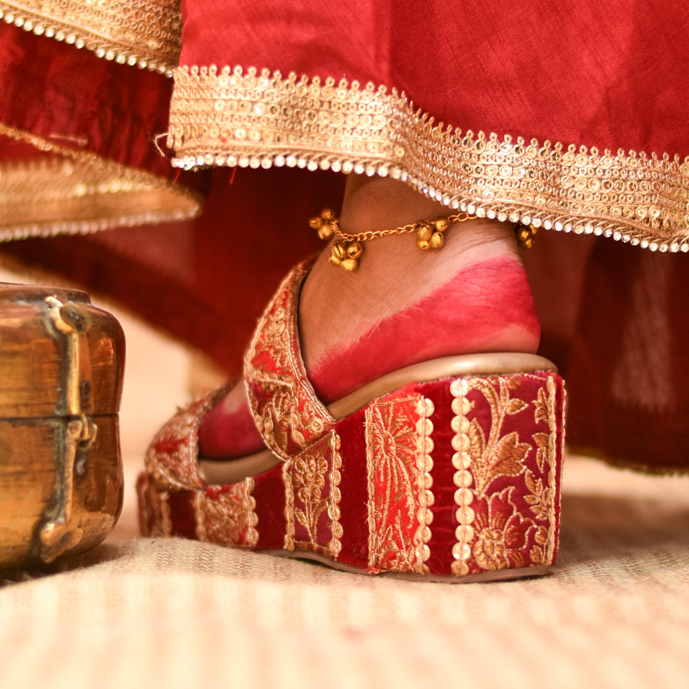 Festive platform heel with embroidered base and sequin details
