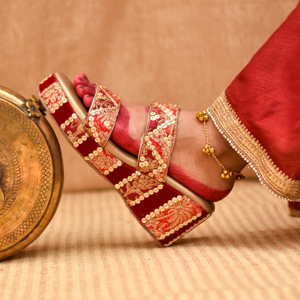 Ethnic occasion footwear with red and gold motifs and cushioned wedge
