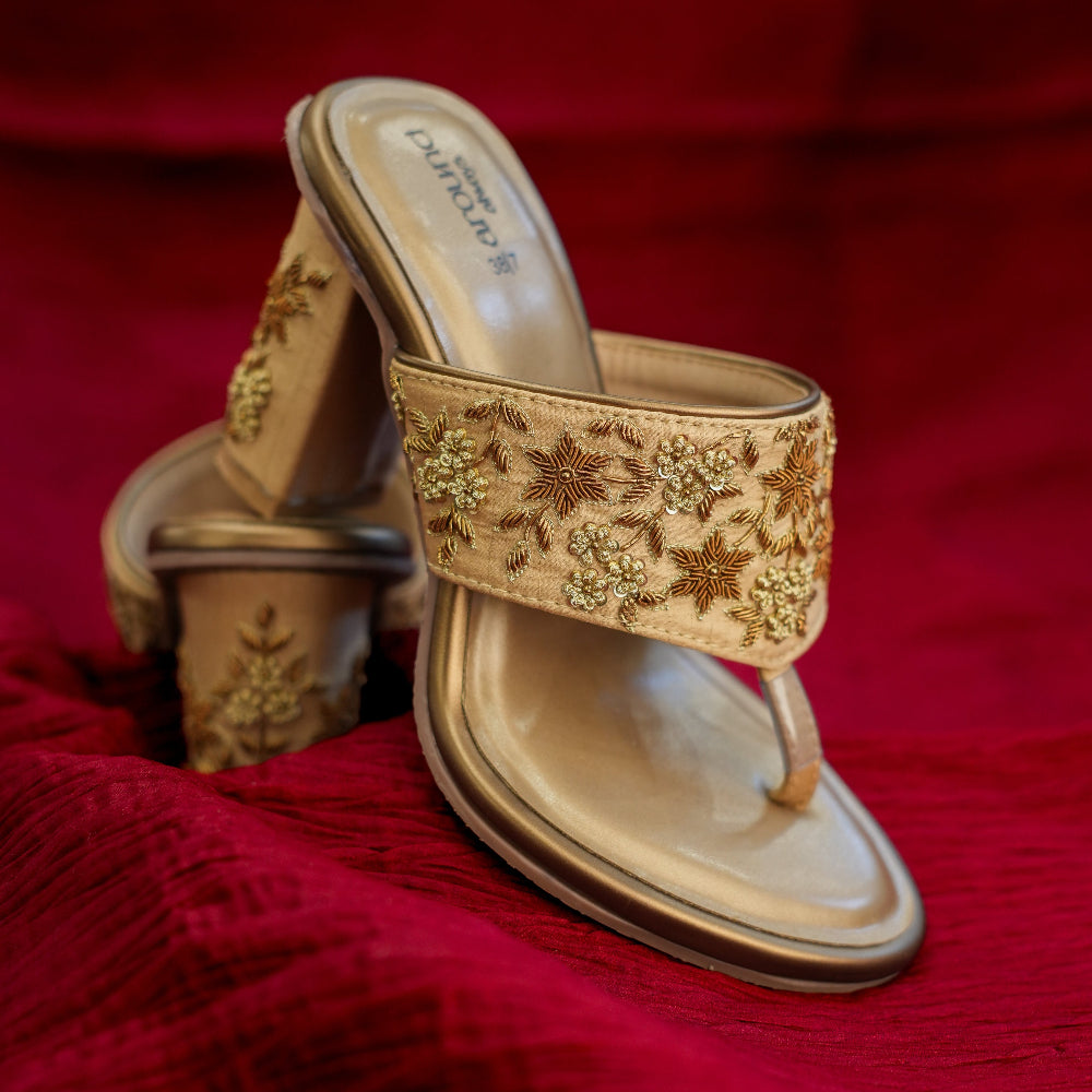 Gold sandal with sequin and floral detailing
