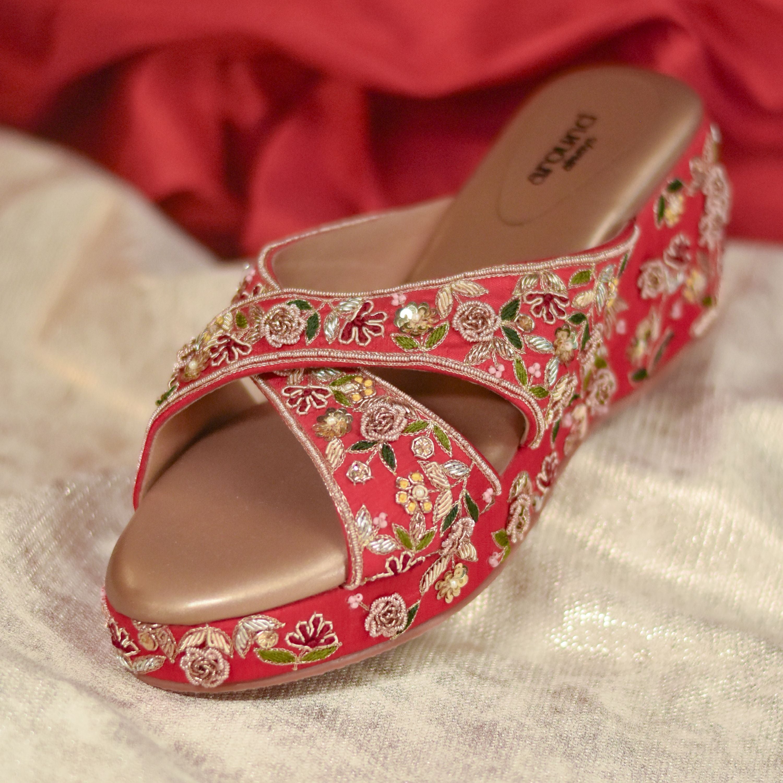 Handcrafted red wedge footwear with cushioned insole