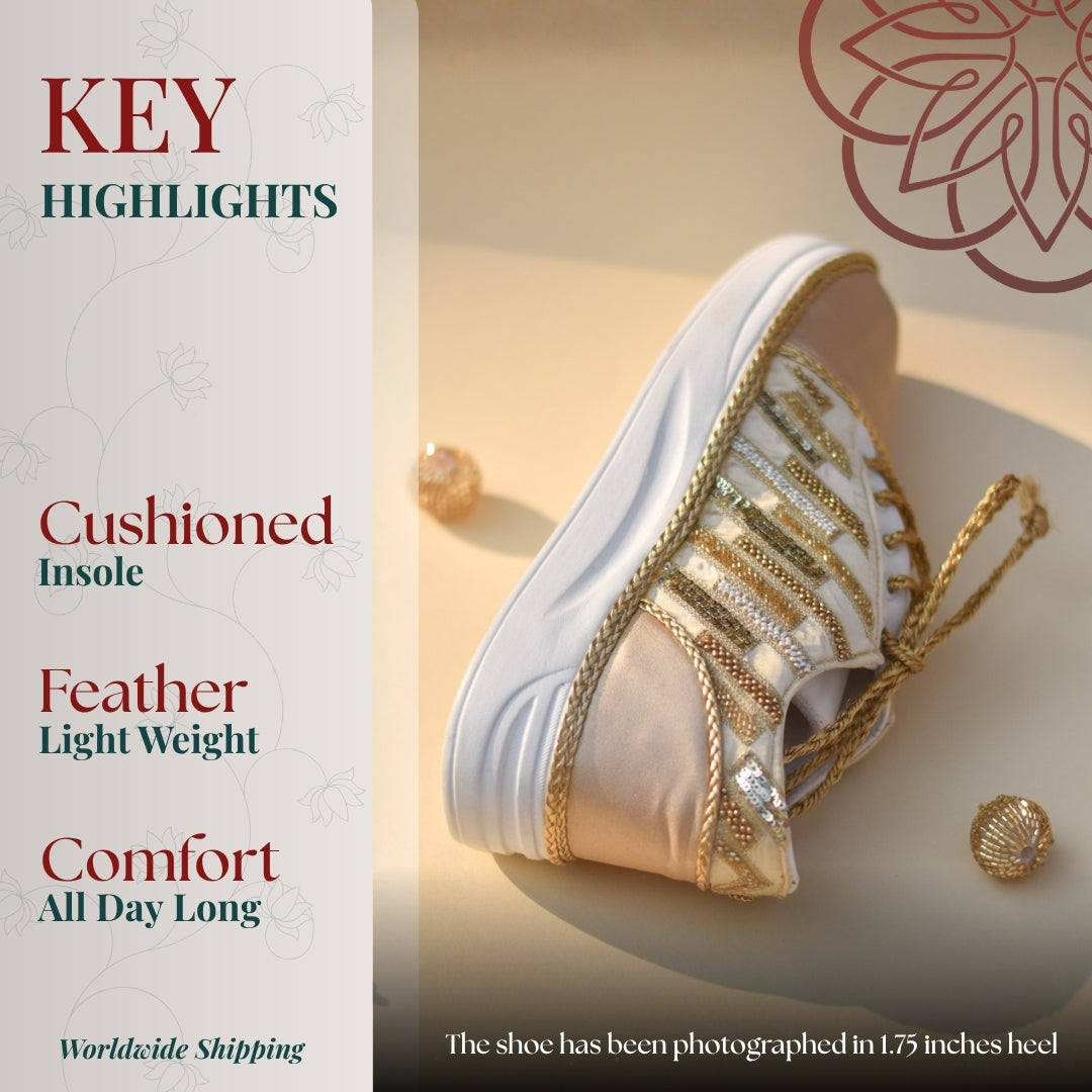 Gold embroidered lace up sneaker with cushioned sole and lightweight feel