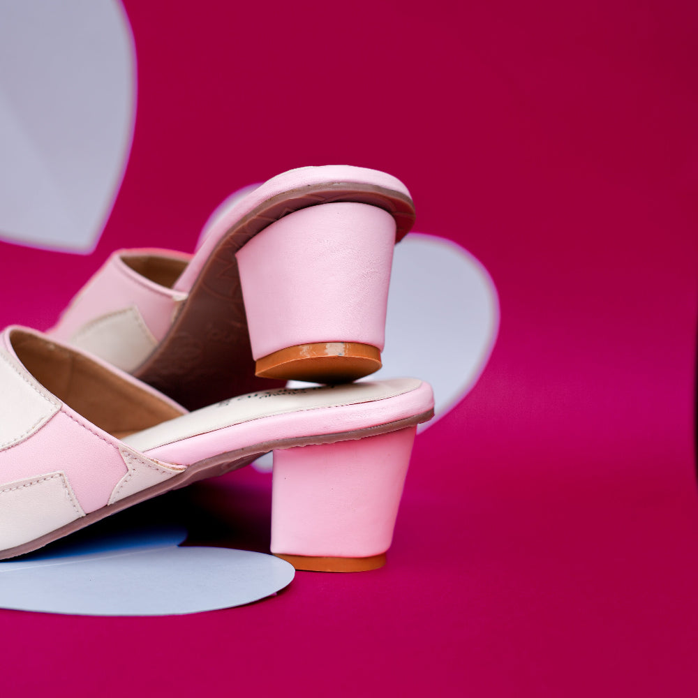 Pink occasion mule with heart detailing across the front strap