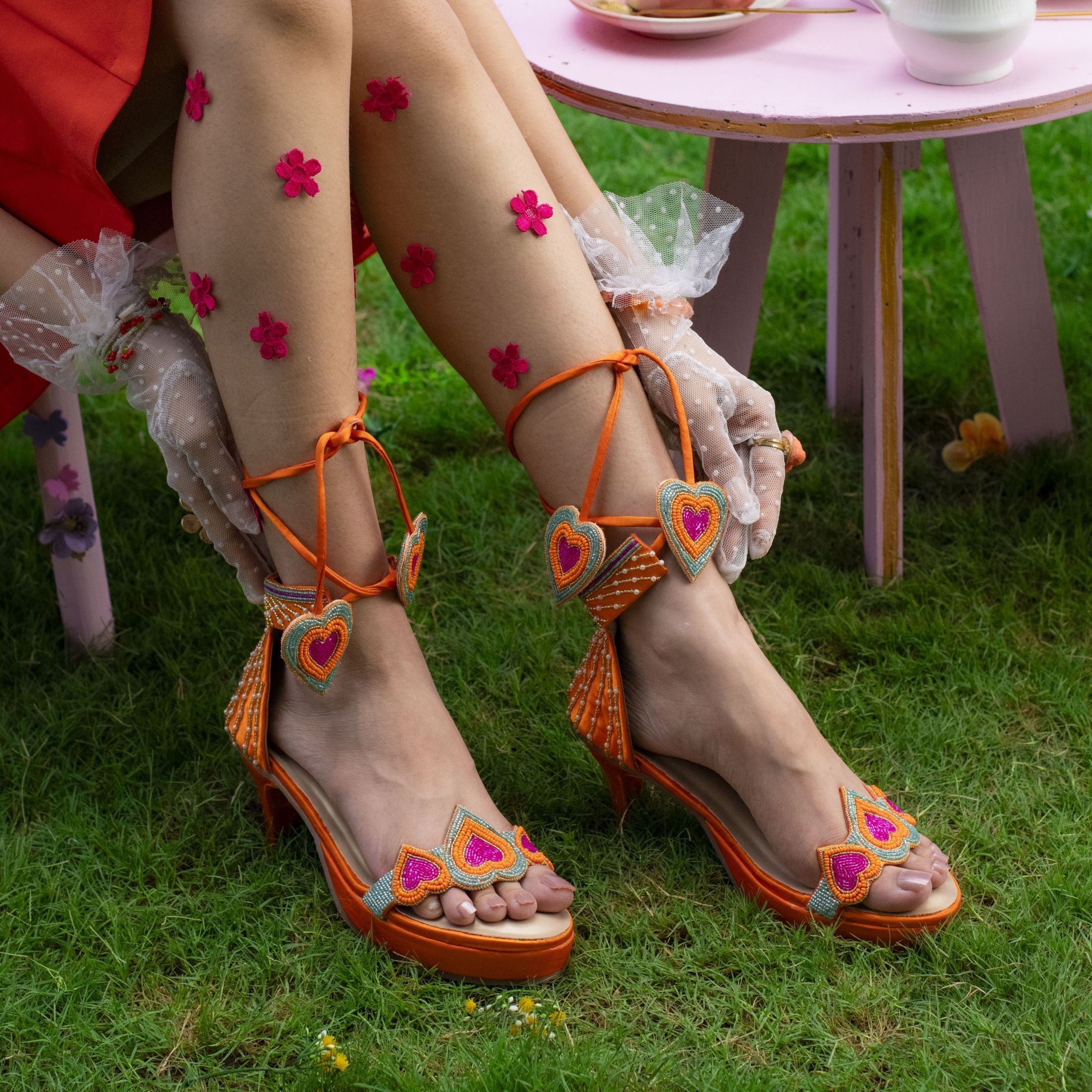 Statement heels with heart embellishment and tieback straps