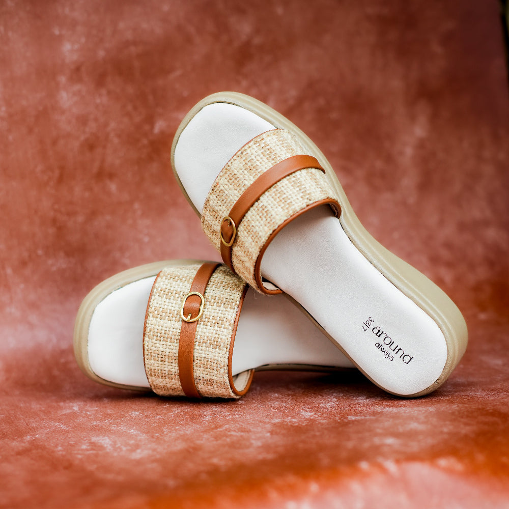 A pair of comfortable beige tan sliders for 12-hour daily wear 
