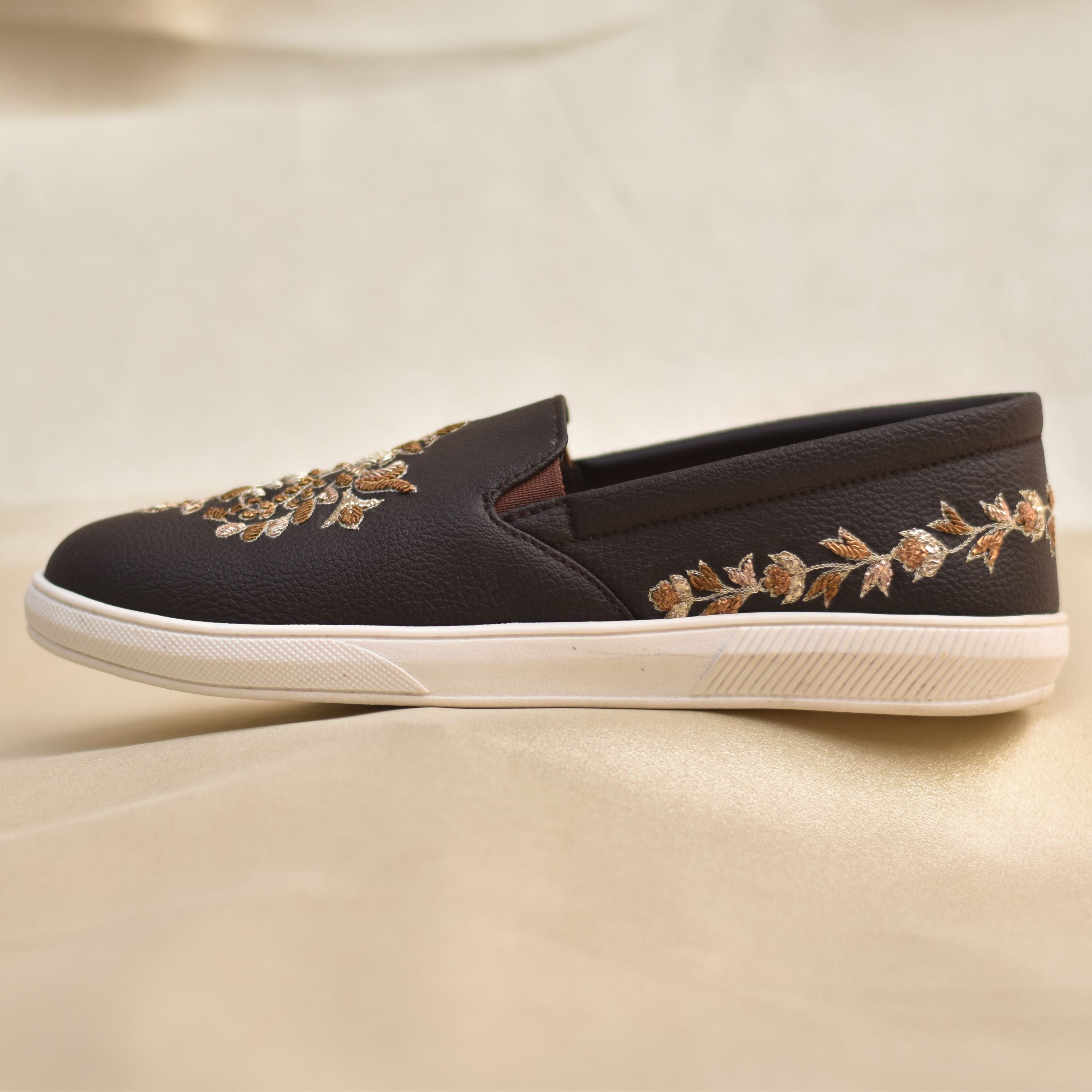 Festive groom footwear merging heritage embroidery with relaxed silhouette.