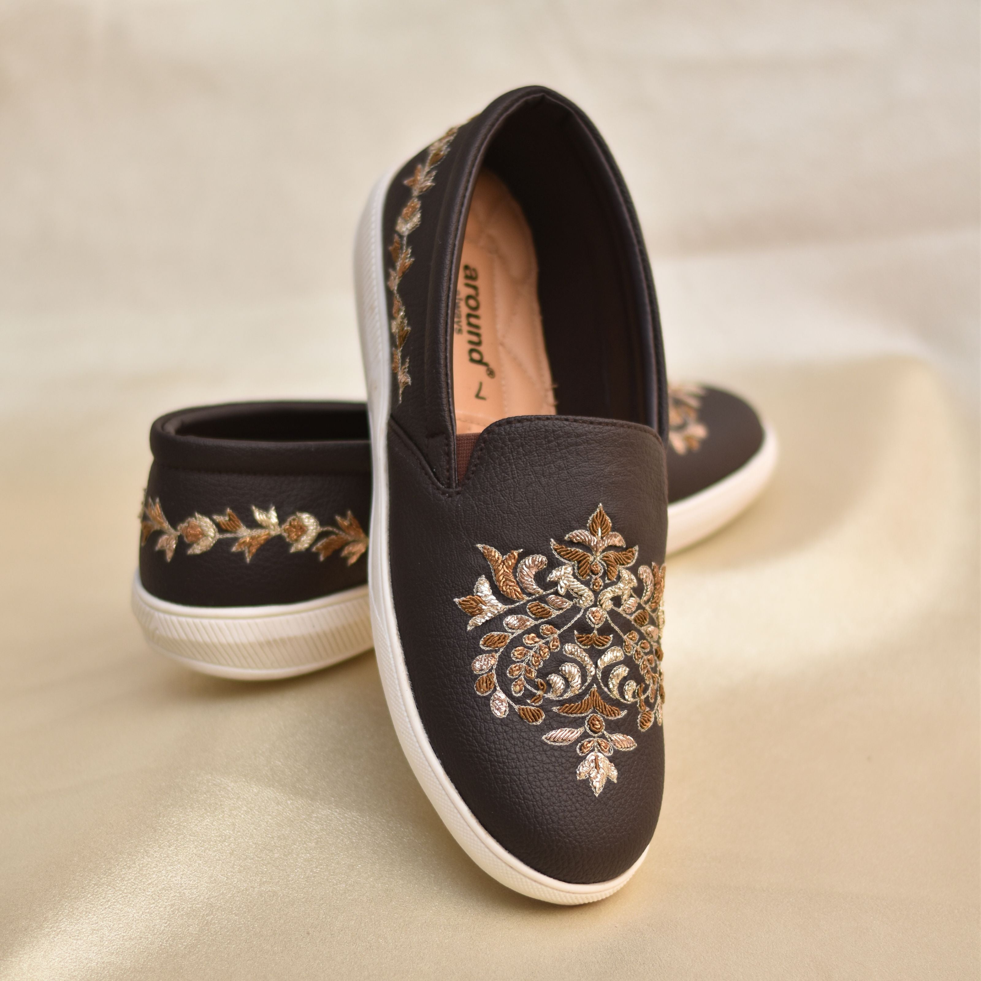 Brown sneakers with Victorian era inspired motif in golden zardozi embroidery and comfort sole