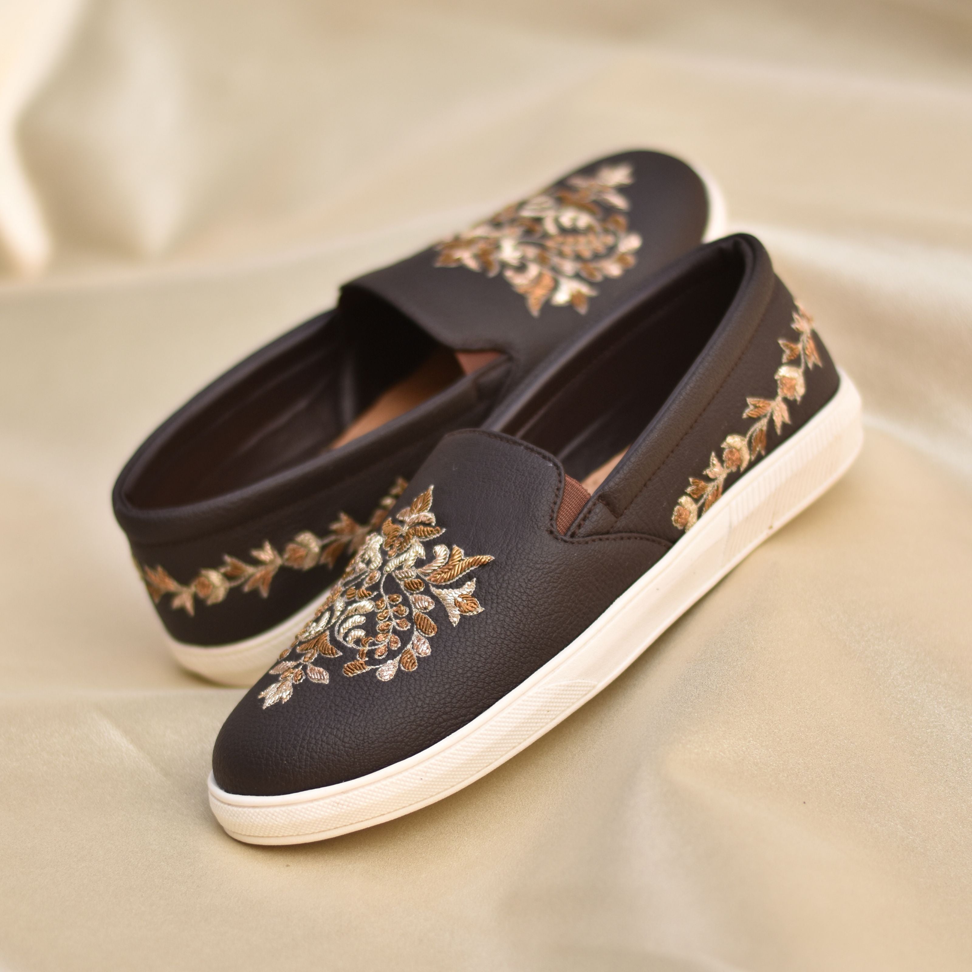 Celebration-ready pair blending traditional zardozi embroidery with sneakers for all day ease.