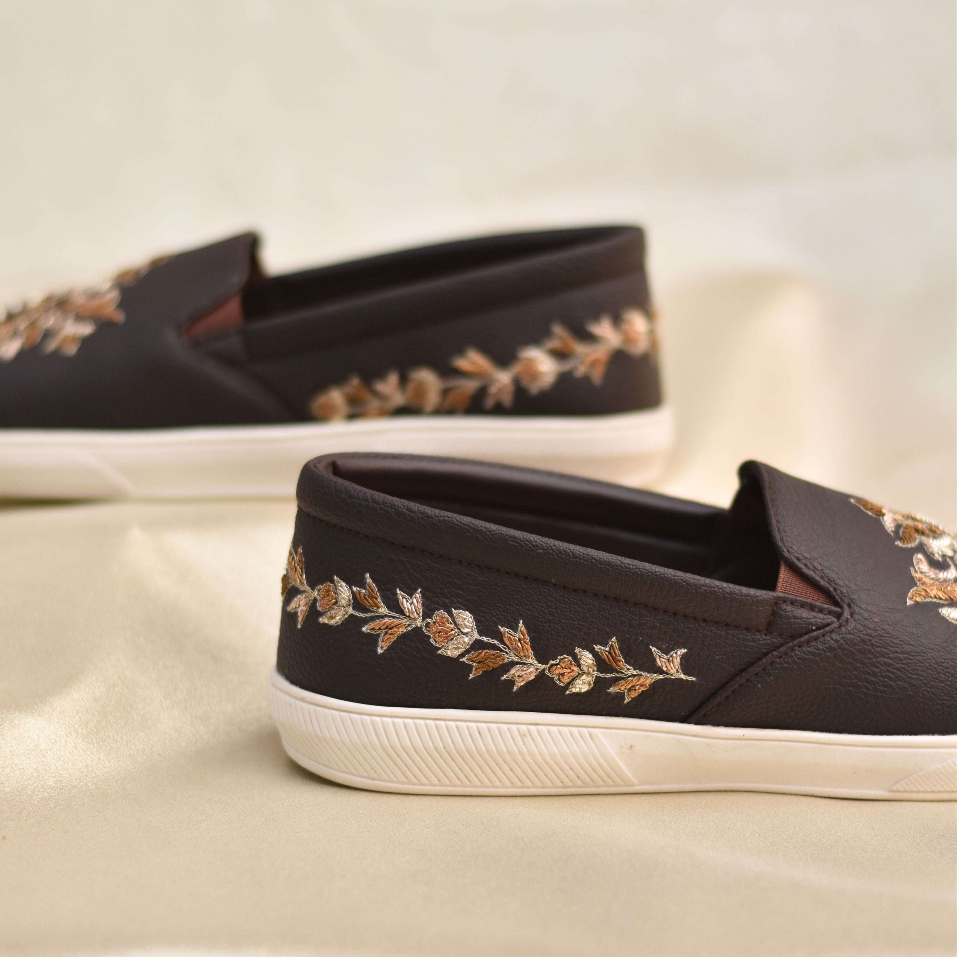 Indo-Western Seakers with regal embroidered motif in light and antique gold and soft cushion support.