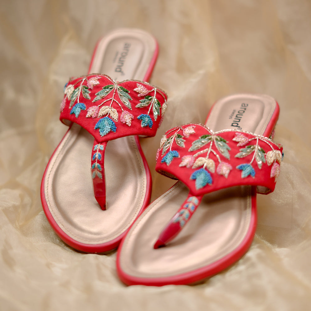 Floral red sandals with handcrafted motifs in blue, green, pink, and gold