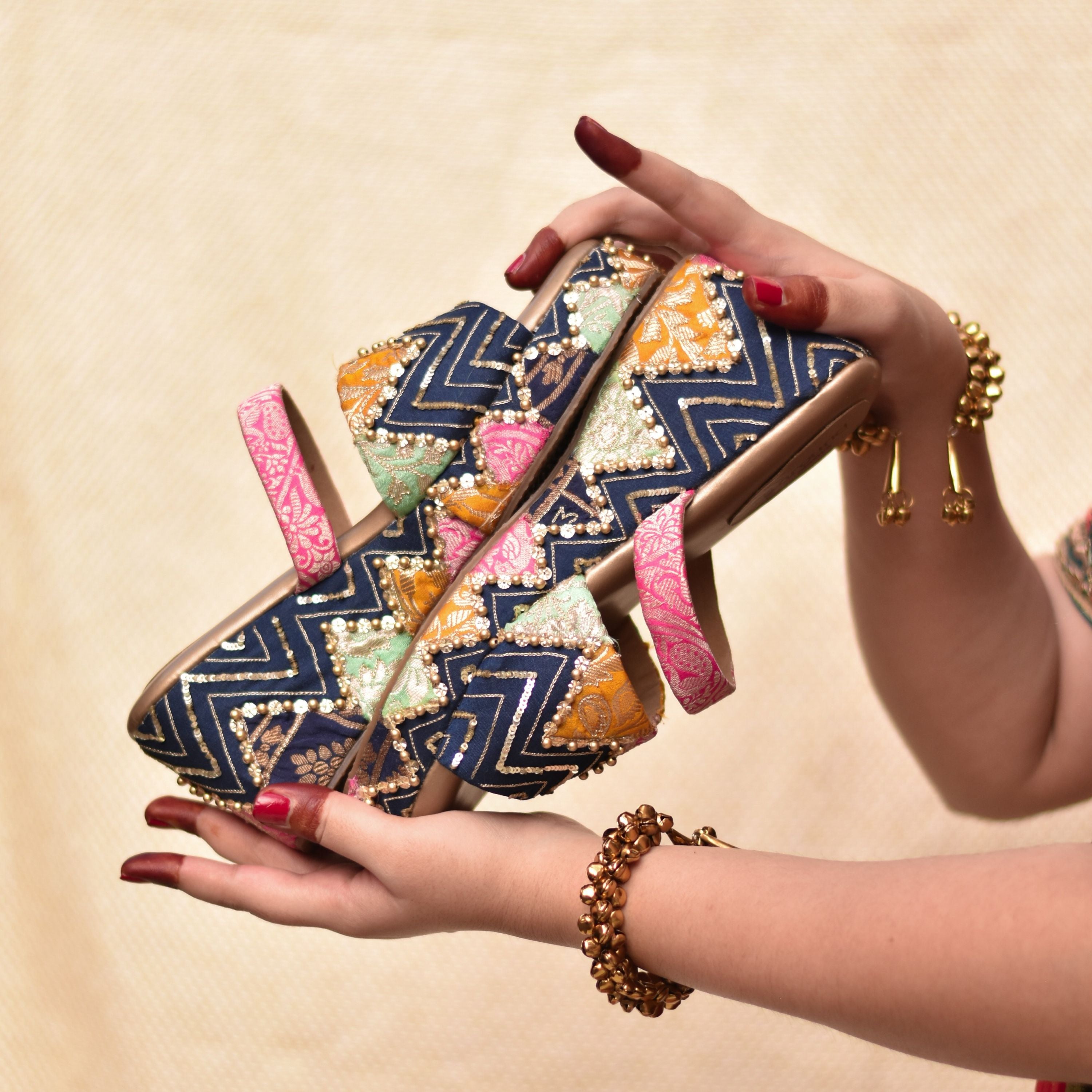 Handmade festive footwear with cushioned sole and embroidered wedge base