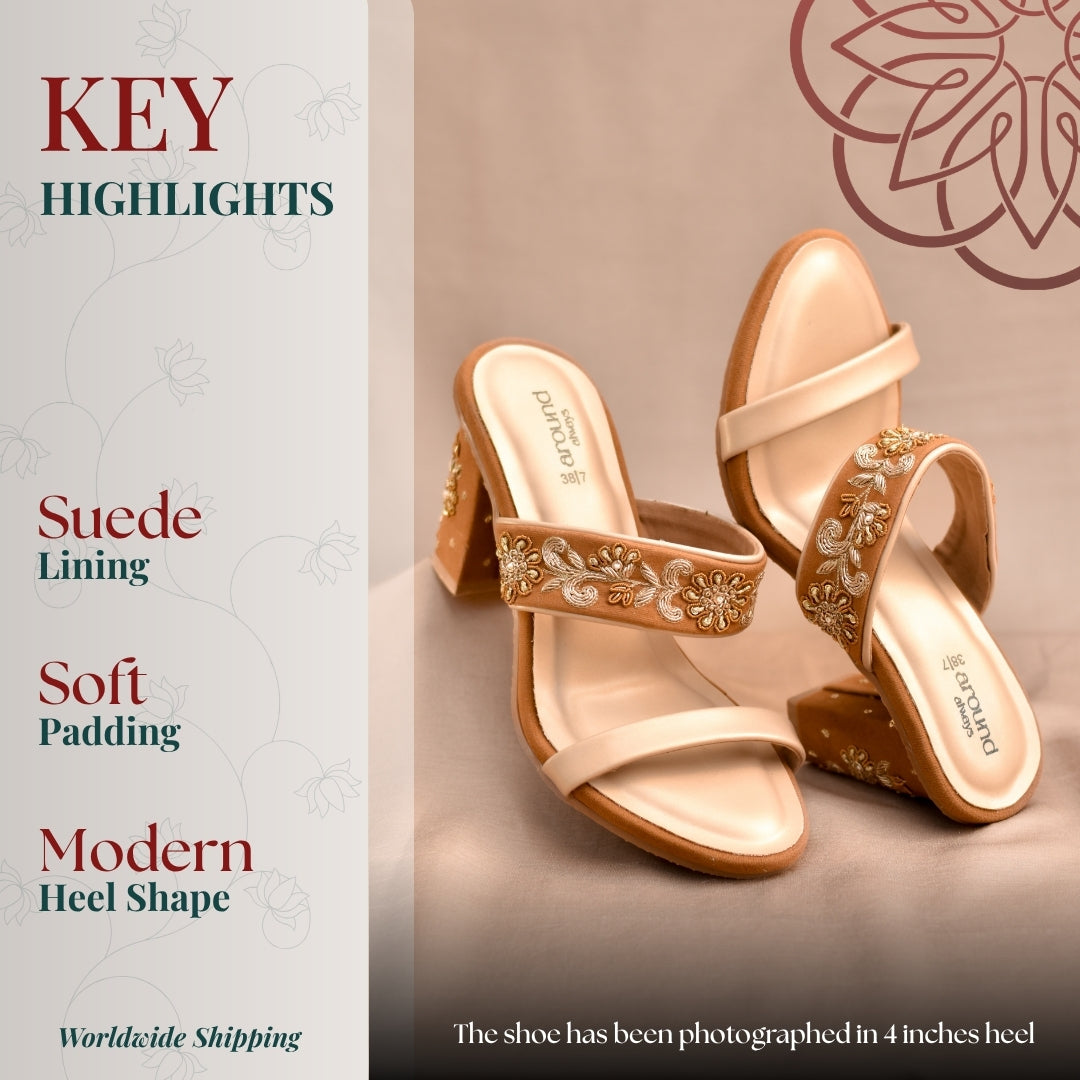 Beige block heel sandals with dual straps, elegant floral detailing for a refined festive look.