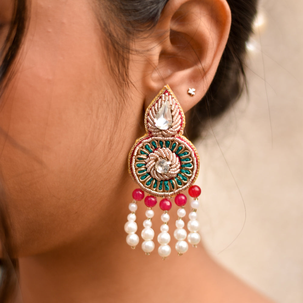 Intricately embroidered beaded and pearl earrings for brides to wear during haldi and mehendi ceremony