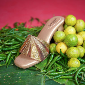 Champagne mule with brown and gold radiating stripe detailing
