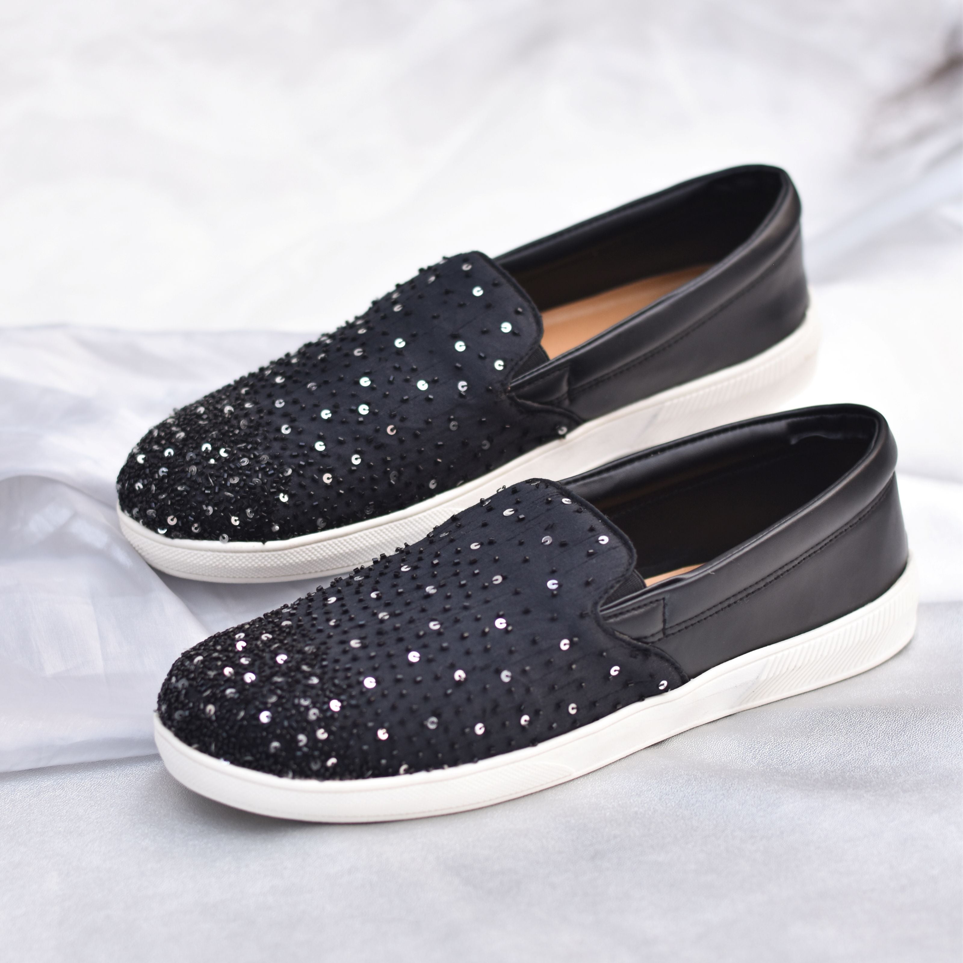 Black party sneakers featuring hand-done sequin and bead detailing up front.