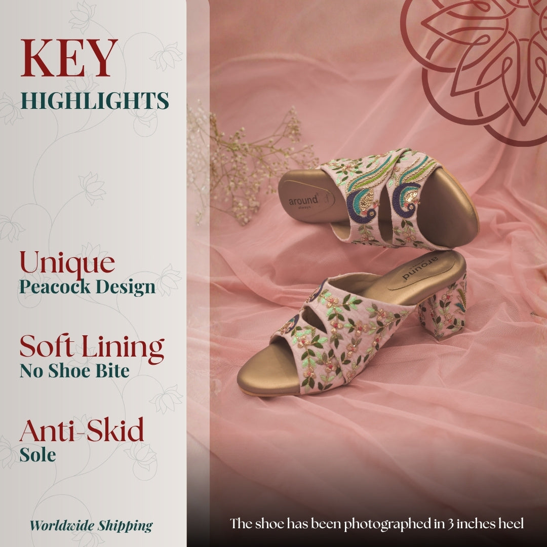 Pink block heel sandals detailed peacock embroidery, soft lining, and anti skid sole for stable, stylish wear.