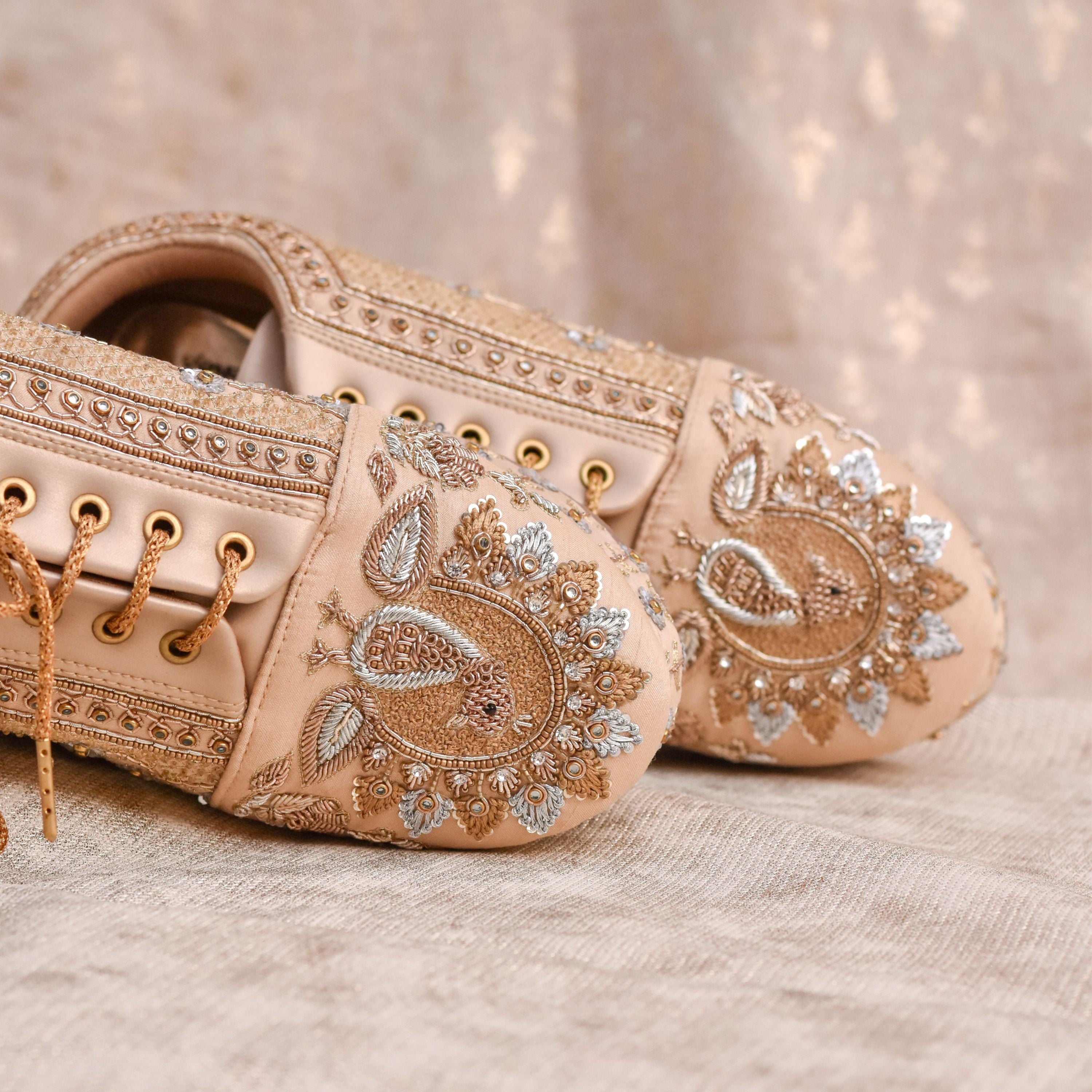 
Designer platform sneakers with heavy sequin and thread floral detailing.