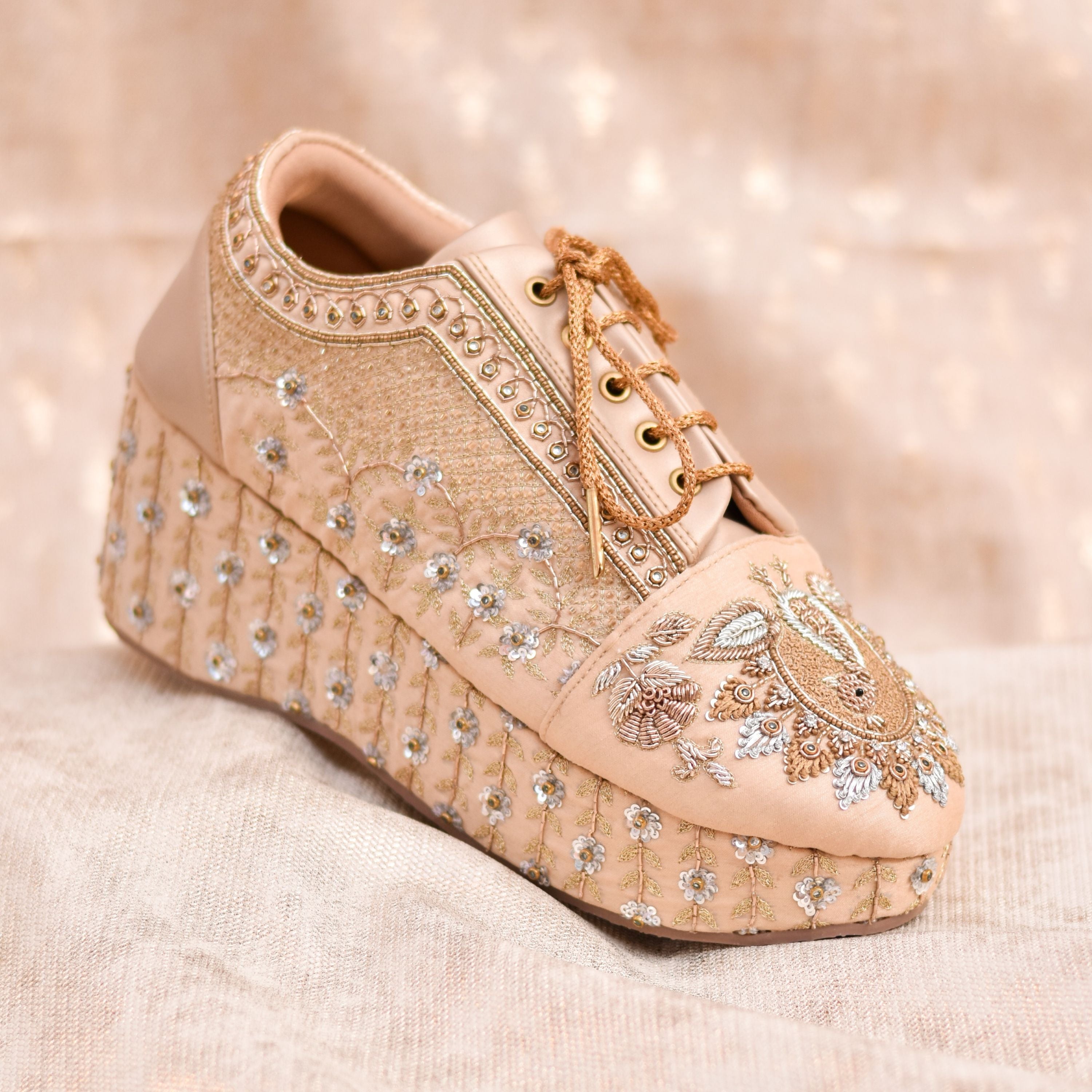 Bridal wedge sneakers in gold with embellished base and embroidery.
