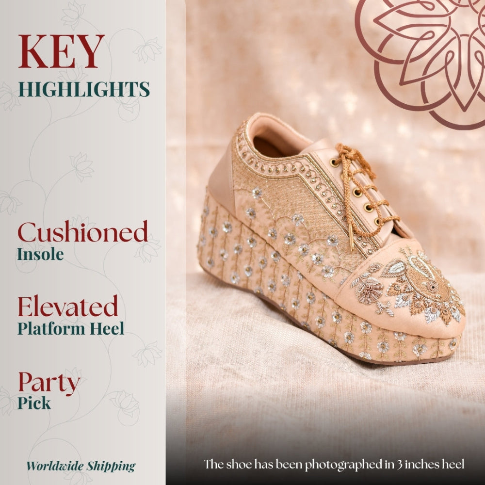Peach embroidered wedge sneaker with floral detailing and elevated platform heel for a festive.