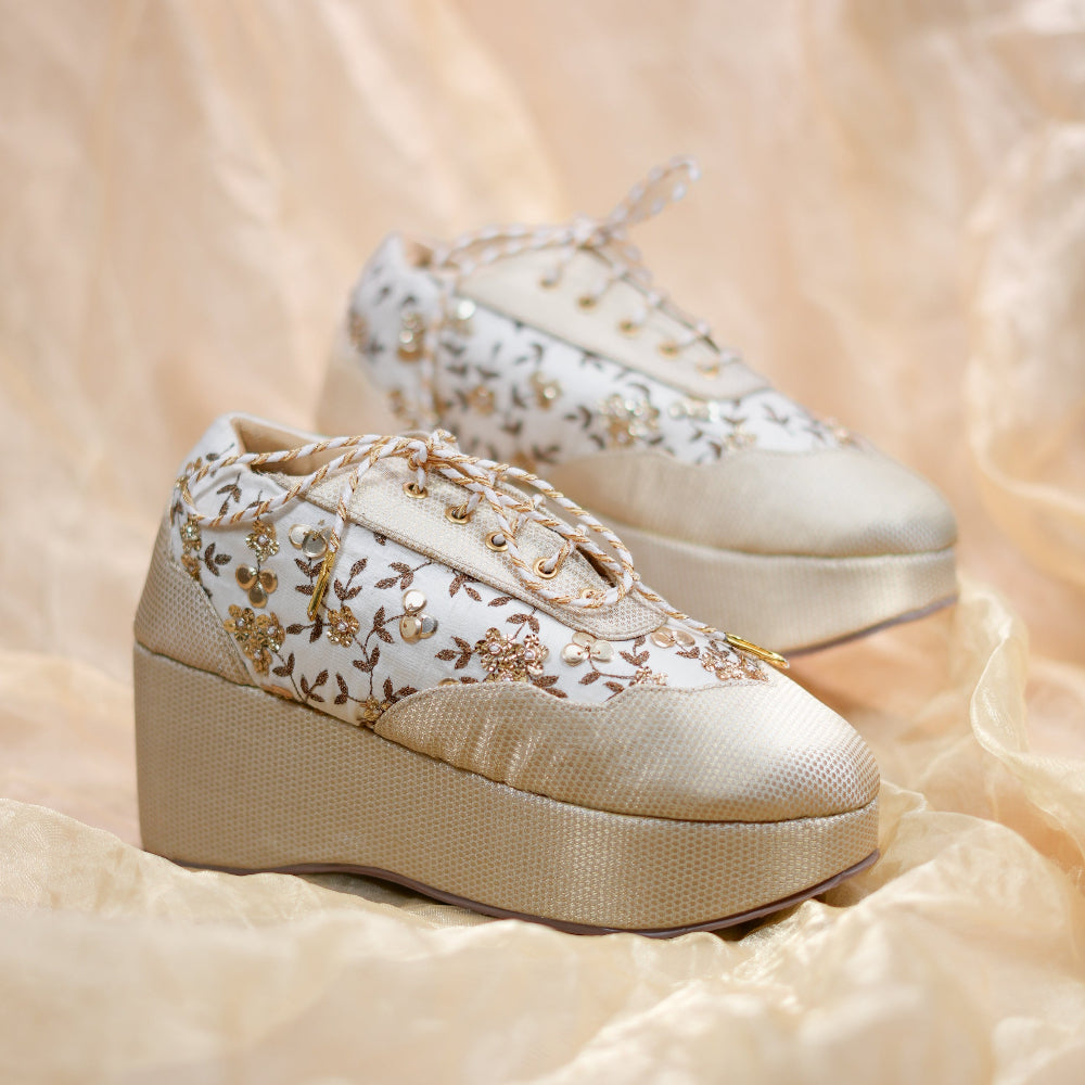 Wedding sneaker wedges with textured platform, floral detailing, and comfortable raised heel