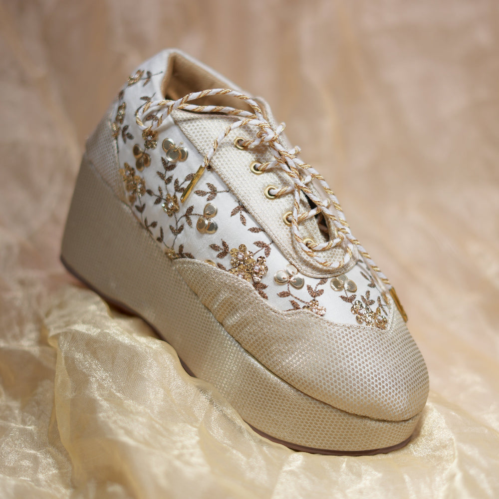Bridal wedge sneakers in ivory with floral thread detailing and decorative sequin work