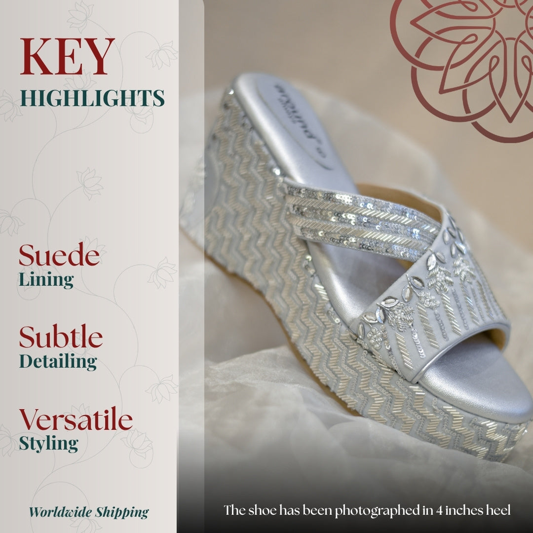 Silver wedge slides with intricate sequin detailing