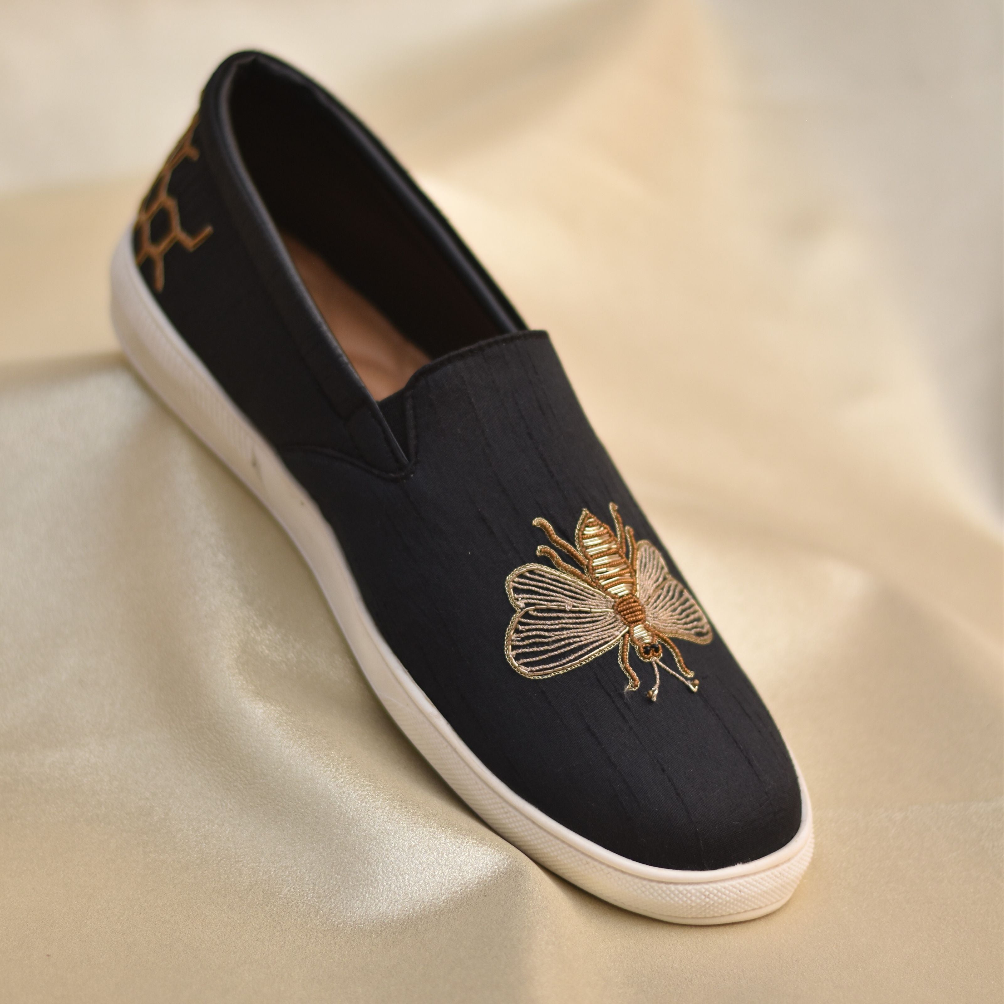 Occasion-ready slip-ons with unique design elements and edgy finish.