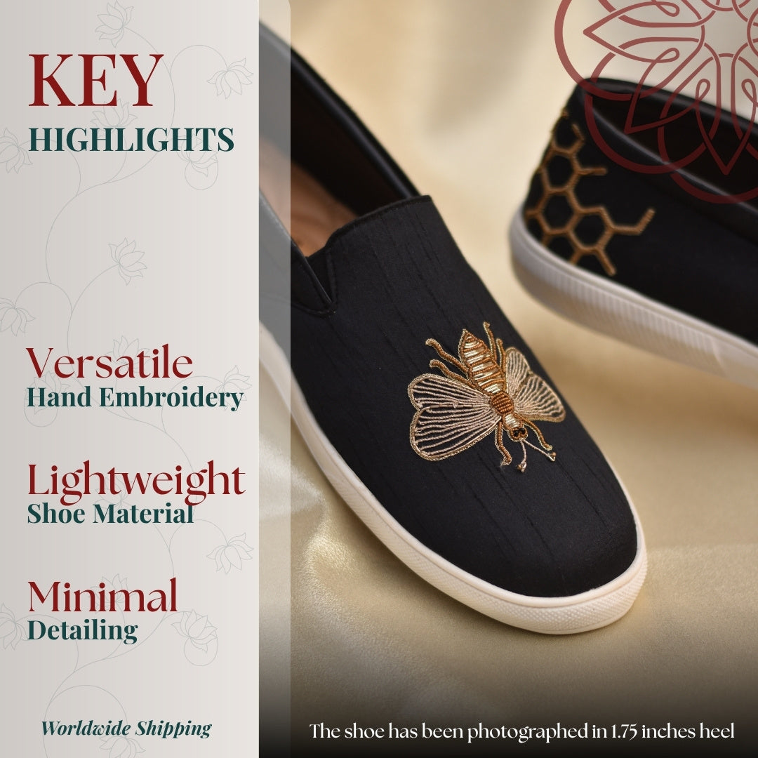 Black slip ons sneaker with bee pattern embroidery