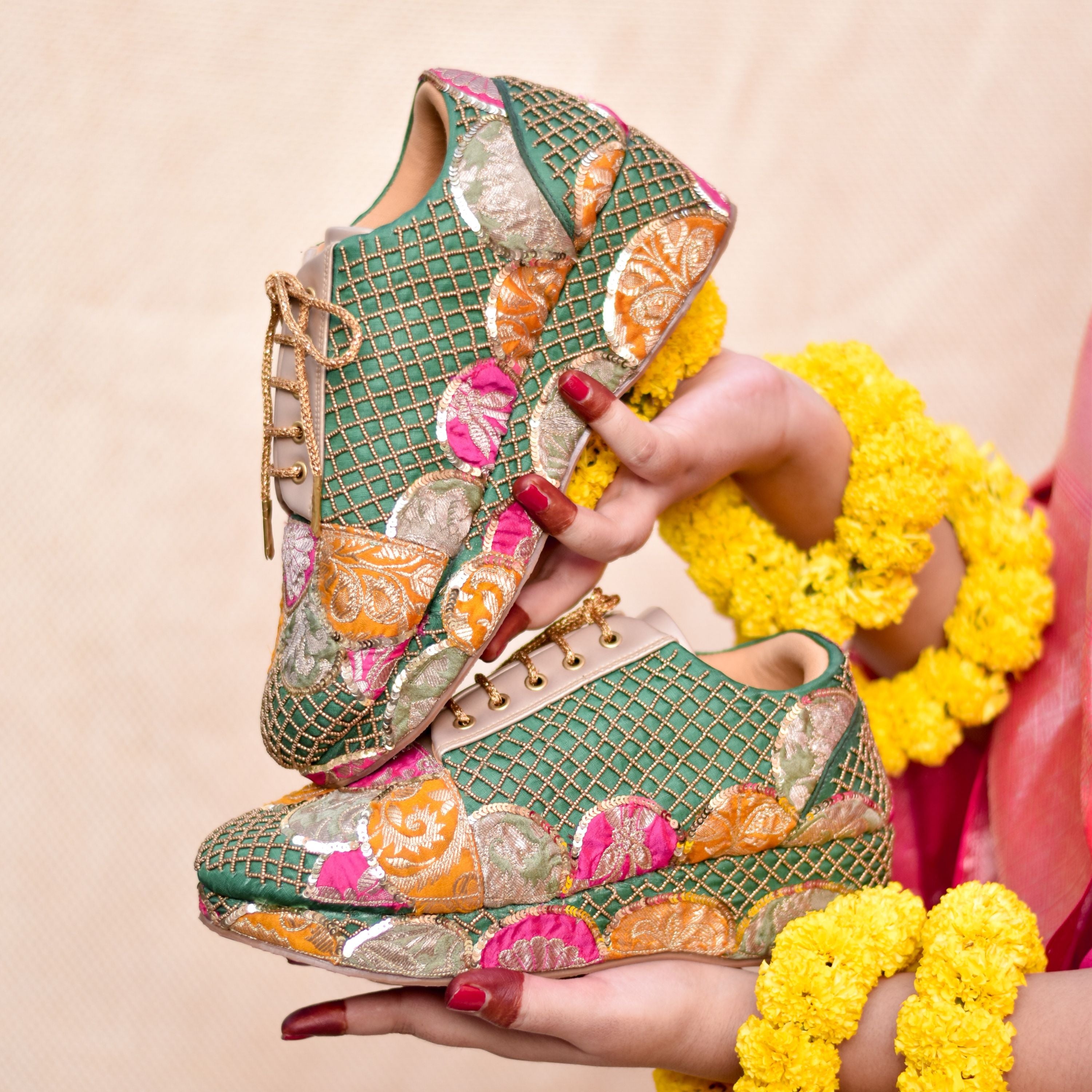 Green sneaker with gold lattice and multicolour brocade patches