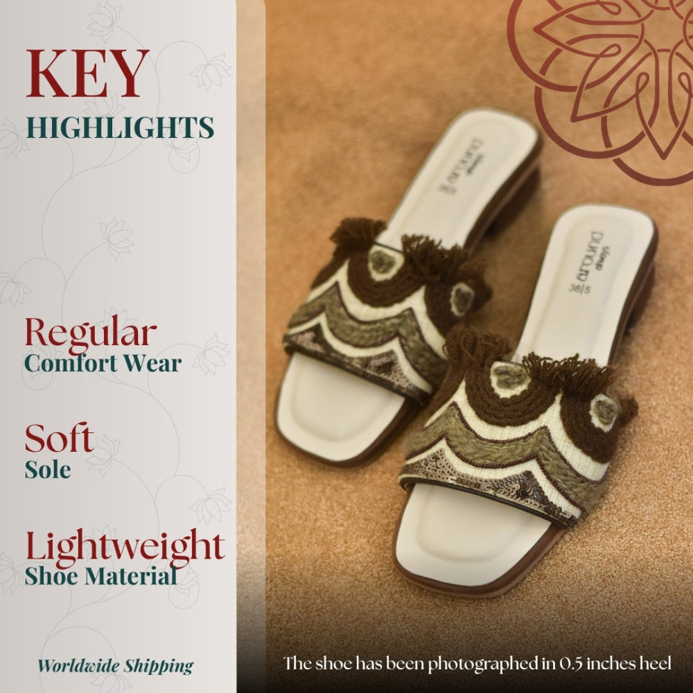 Embroidered slip on sandals with textured upper and flat sole for casual wear