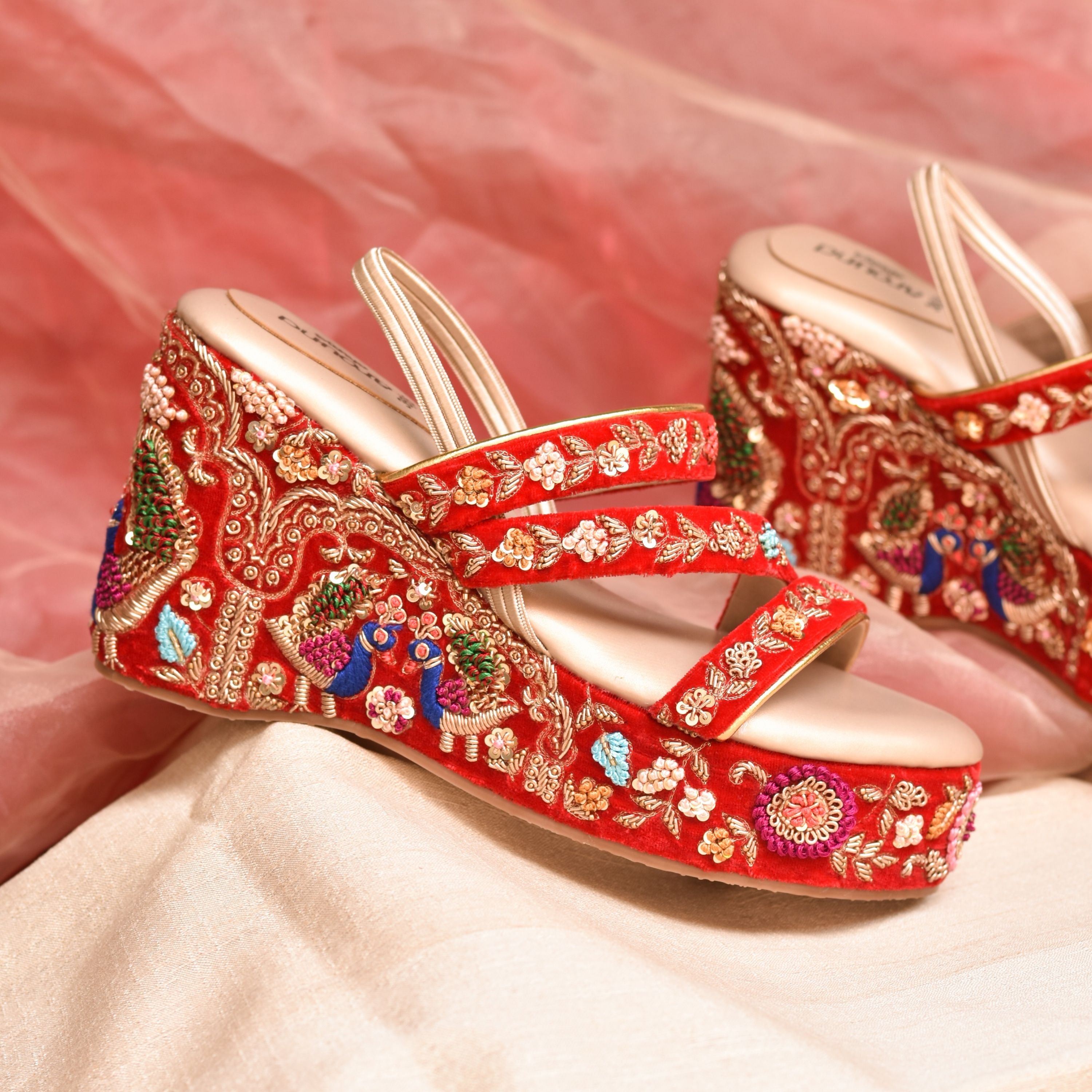Festive red wedding wedges with floral and metallic embroidery.