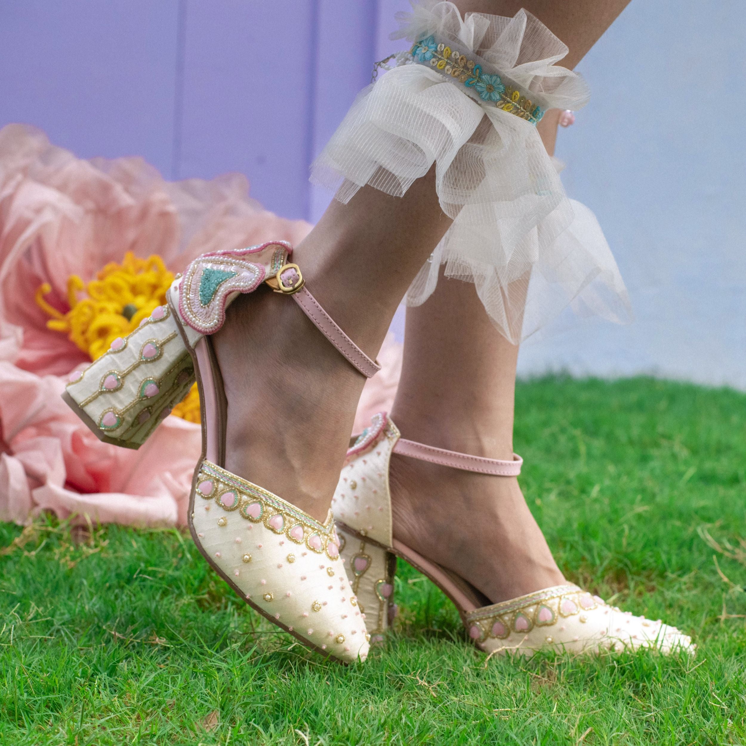 Statement heels with beadwork and patel colour details