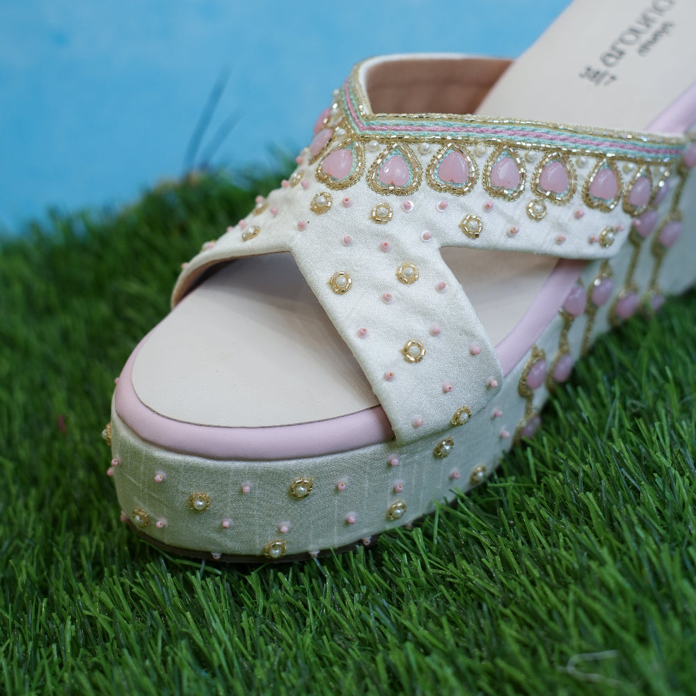 Ivory occasion sandals with multicolour trim and pink detailing
