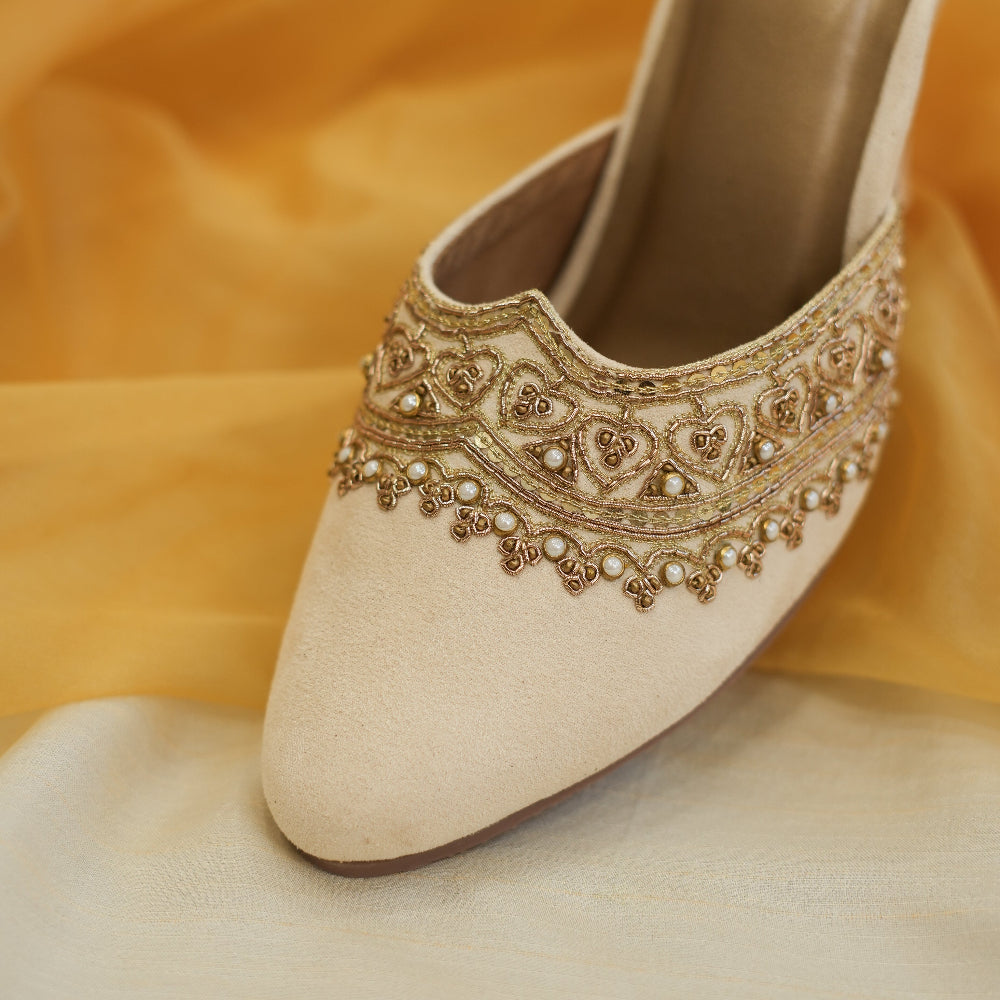 Champagne high heel slip-on shoes with intricate embellishments
